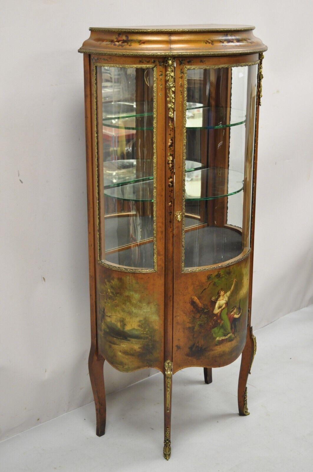 Antique French Louis XV style small bowed glass painted curio display cabinet. Item features (3) bowed glass panels, hand painted scene to front and sides, lighted interior, working lock and key, 2 glass shelves, very nice antique item, great style
