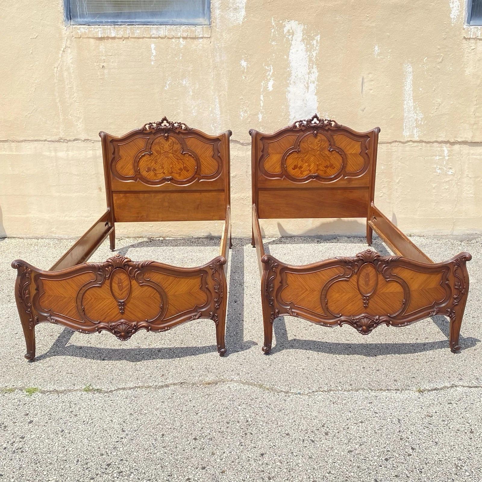 Please message us with your zip code to request a more reasonable domestic U.S. shipping quote.

Antique French Louis XV Style Walnut Satinwood Inlay Twin Bed Frames - a Pair. Circa Early 20th Century. Measurements: 46