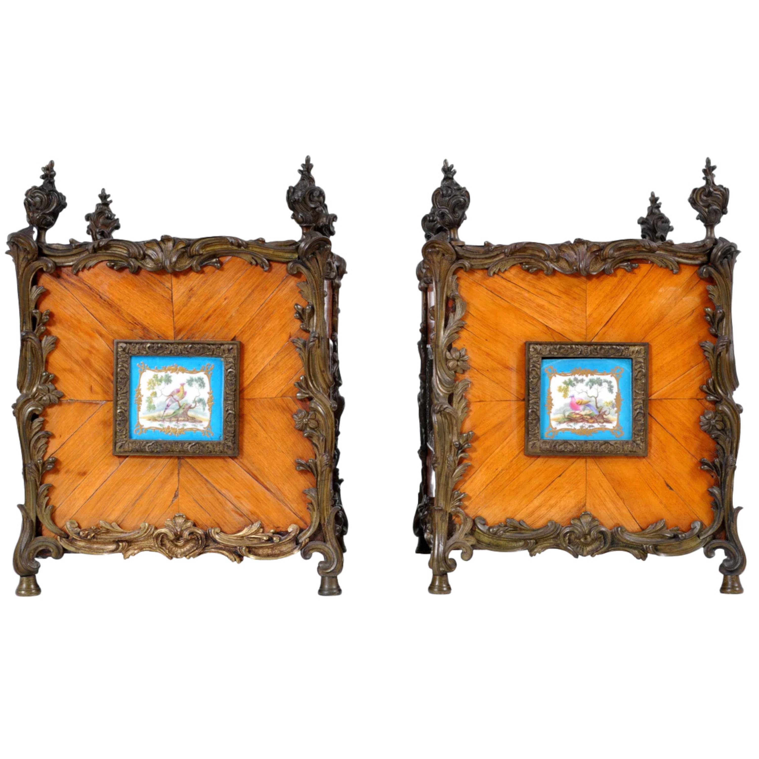 Pair of antique French Louis XV Tulipwood and Sèvres Porcelain jardinières / Planters, circa 1870. The planters having bronze flame finials and Rococo gilded bronze mounts, each side having a feather-banded tulipwood panel inset with Bleu Celeste
