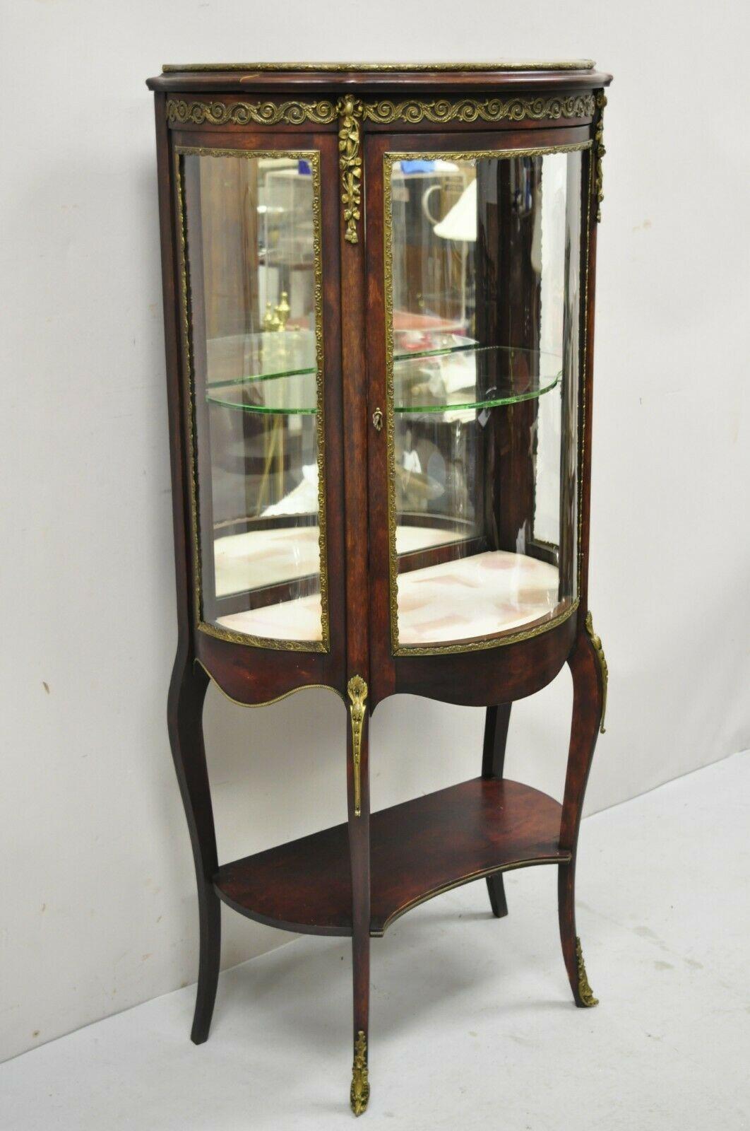 Antique French Louis XV Victorian Mahogany Bowed Glass Curio Vitrine Display Cabinet. Item features a curved bow front glass door and sides, bronze ormolu, lower shelf, 1 glass shelf, cabriole legs, very nice antique item, quality French