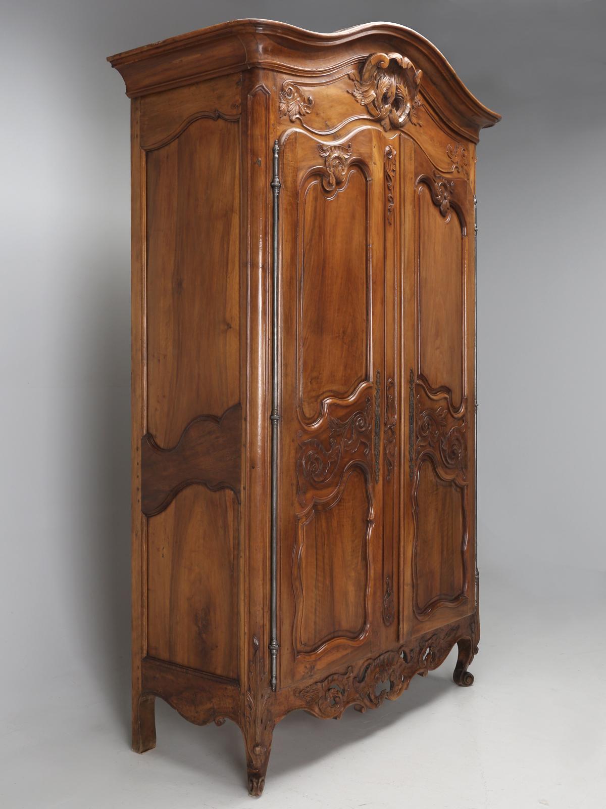 Antique Large Walnut French Armoire from the 1700's. Louis XV, ruled as King of France from 1715, until 1774. Over the years, we have imported some pretty spectacular Antique French Louis XV Armoires, but few finer than this example. The interior of