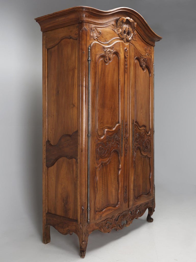 Louis XV, ruled as King of France from 1715, until 1774. Over the years, we have imported some pretty spectacular antique French Louis XV armoires, but few finer than this example. The interior of this French Louis XV armoire, was used to hide an