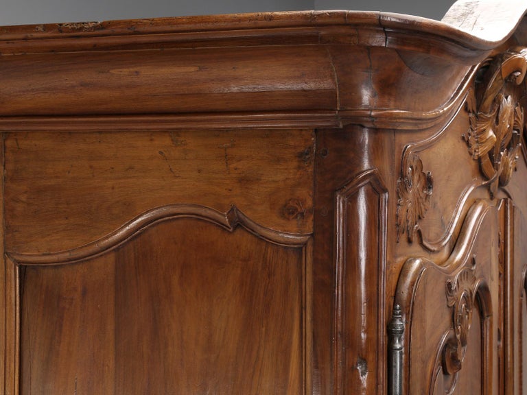 Hand-Carved Antique French Louis XV Walnut Armoire, circa 1700s For Sale