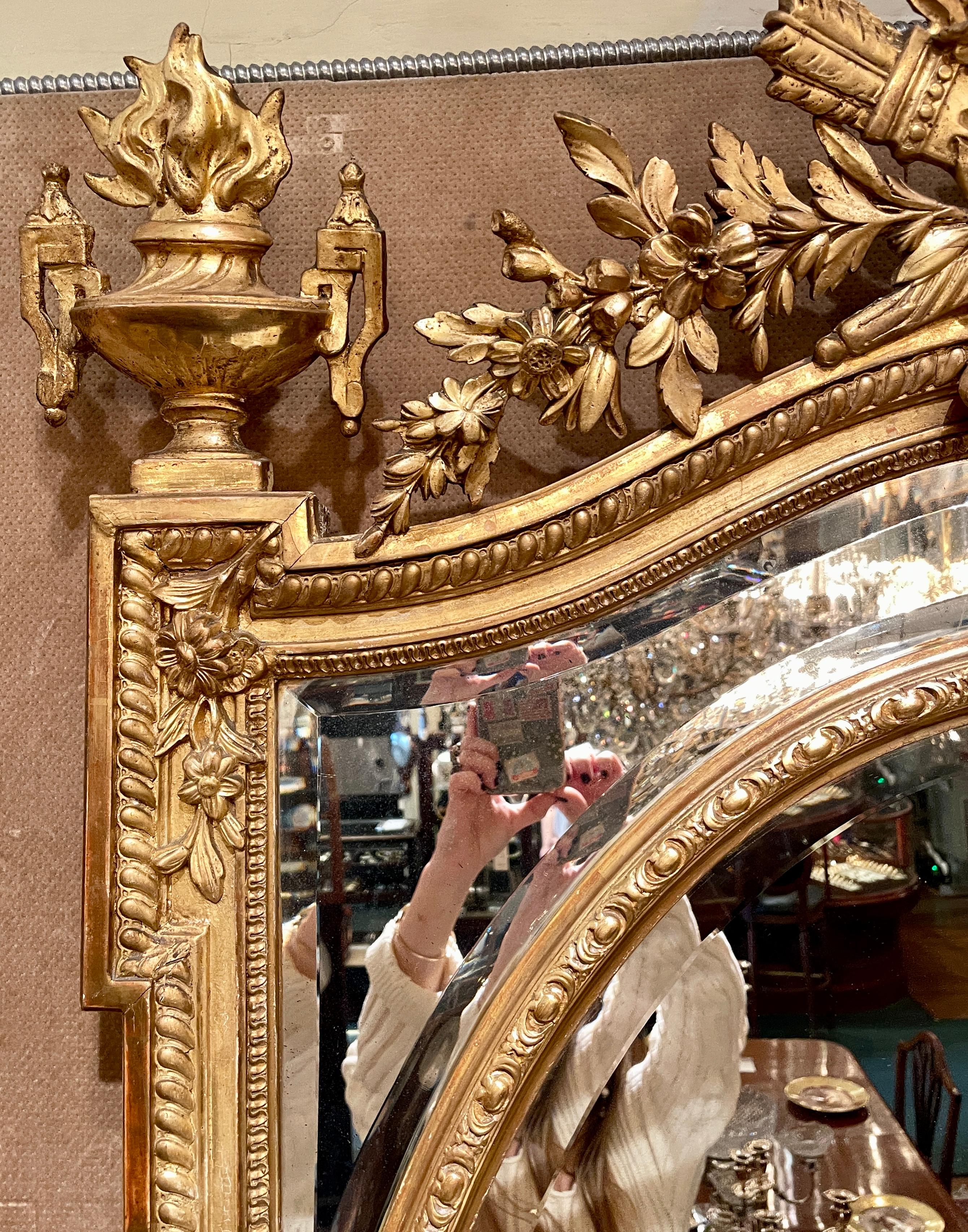 Antique French Louis XVI beveled gold leaf mirror, circa 1880.