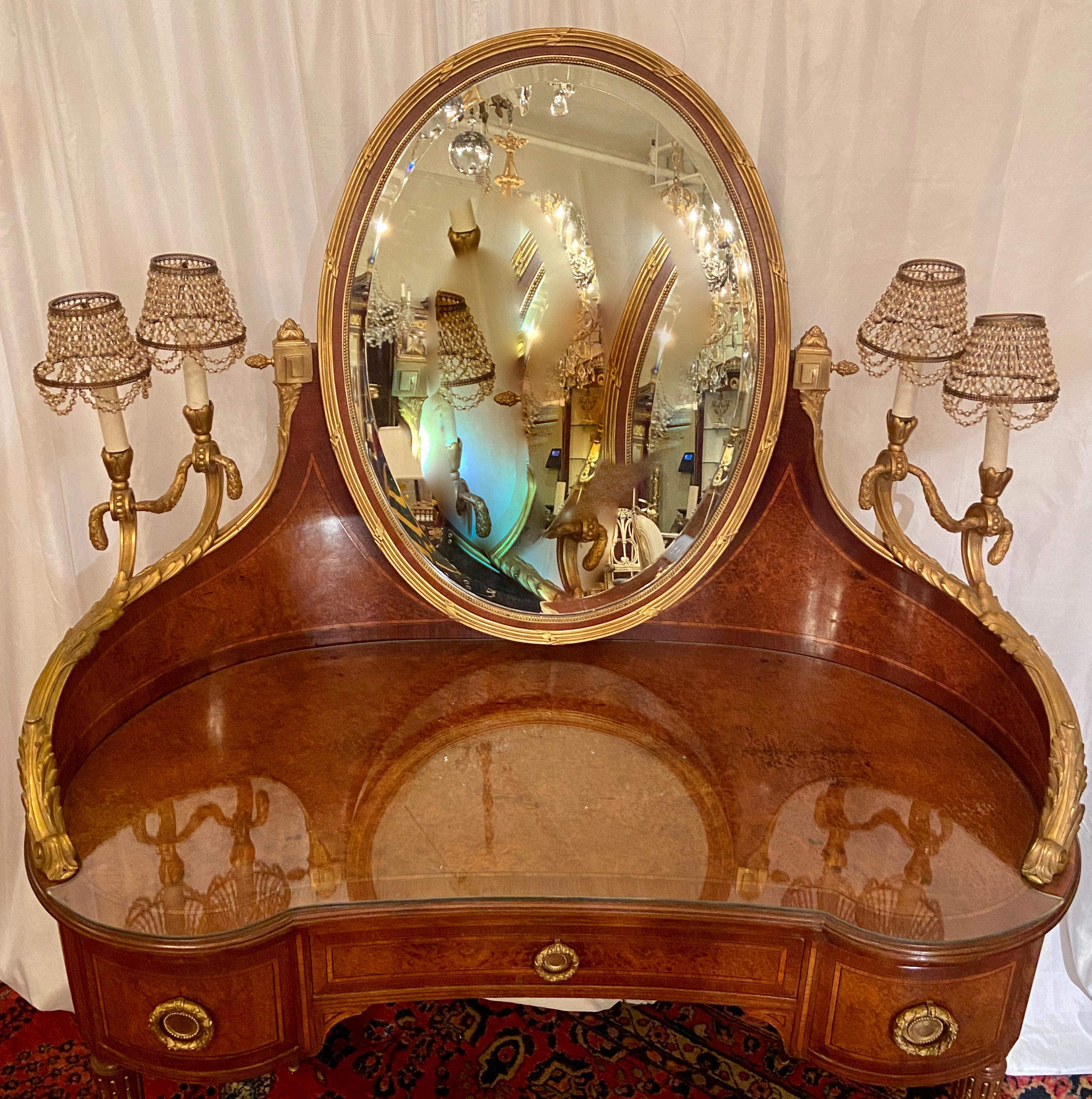 Antique French Louis XVI Bronze D' Ore and Briarwood dressing table with beaded lamps, Circa 1890.
This is a lovely dressing table with four small lights on either side. It is elegant and reflective of the nice French designs of the period.