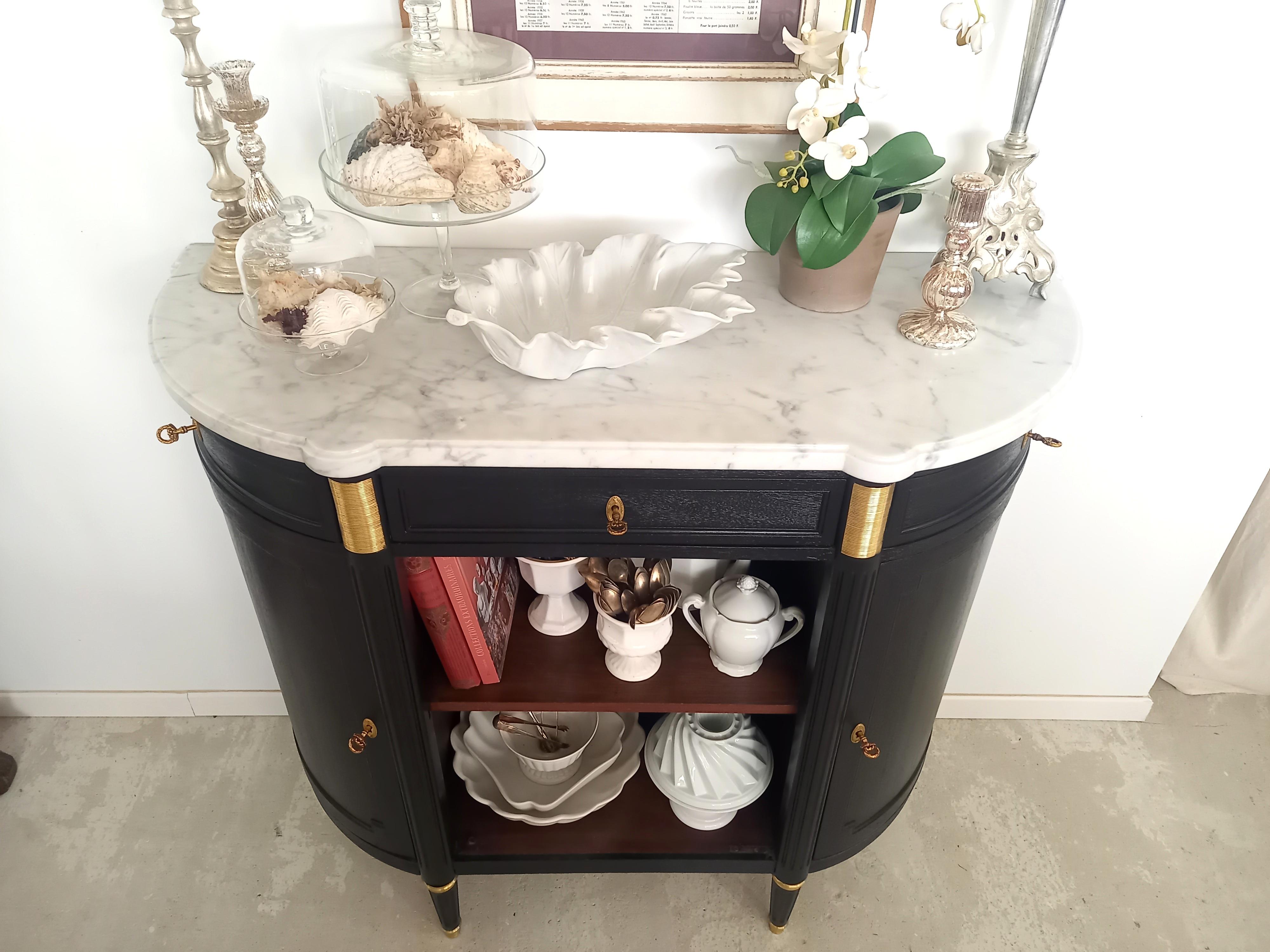 Antique French, Louis XVI style buffet topped with a white Carrara marble, fluted legs finished with golden bronze rings and clogs. 
Three dovetailed drawers and two doors and their keys.
The middle drawer doesn't have a lock, the key acts as a