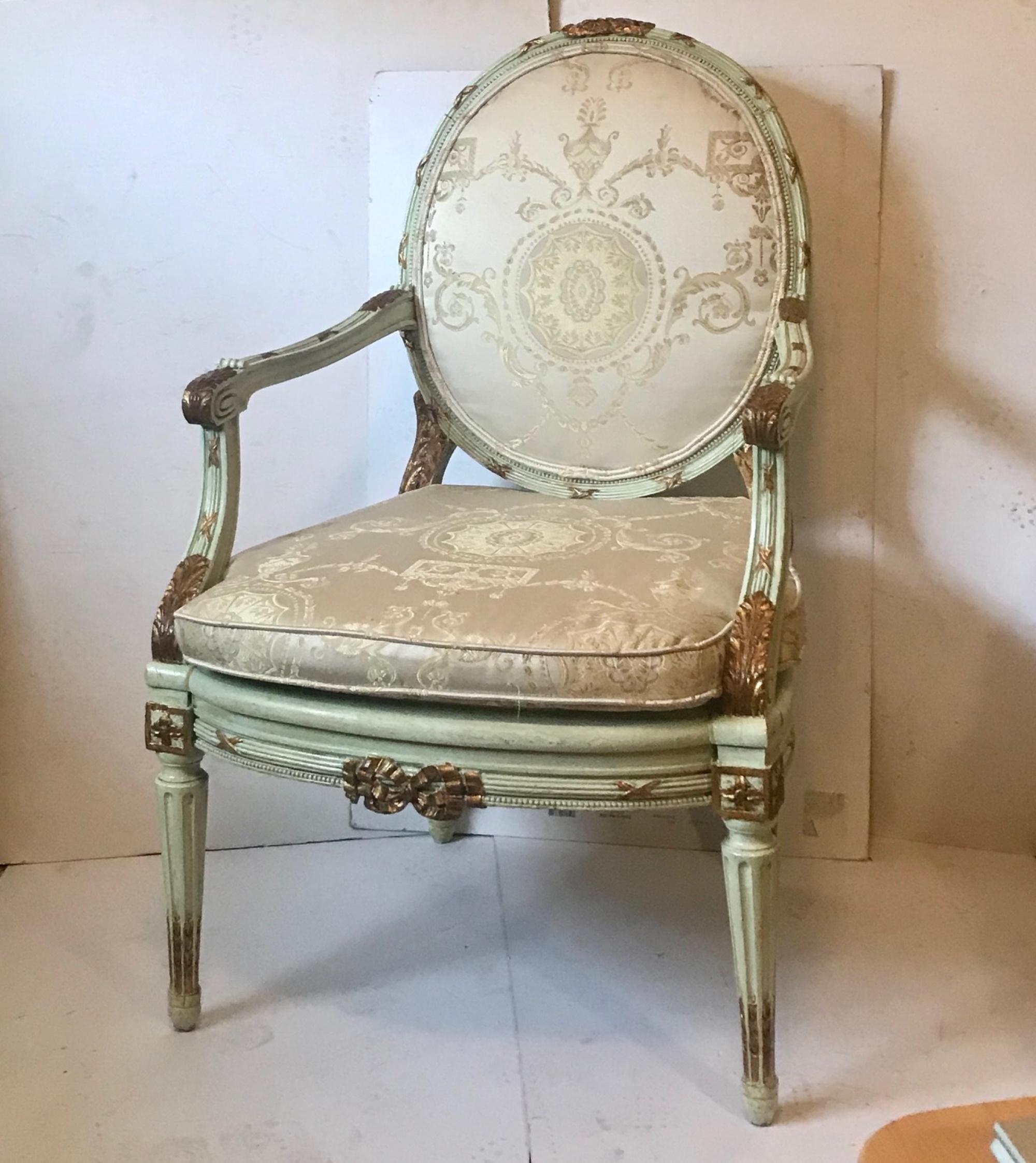 Antique French Louis XVI carved parcel gilded armchair fauteuil.

This lavish period French “Cabriolet” fauteuil armchair is hand carved. The beautiful frame is polychrome and partly gilded. It has an oval back splat, semi upholstered armrests and