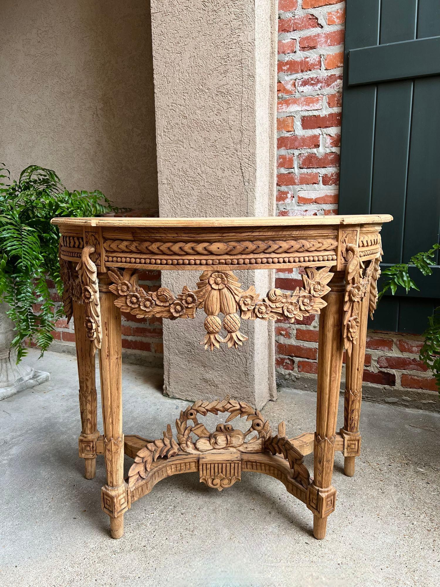 Antique French Louis XVI Console Table Foyer Demilune Carved Bleached Wood c1890.

Direct from France, a highly carved antique French console or foyer table, with classic demilune shape and opulent Louis XVI style. Large dimensional carved floral
