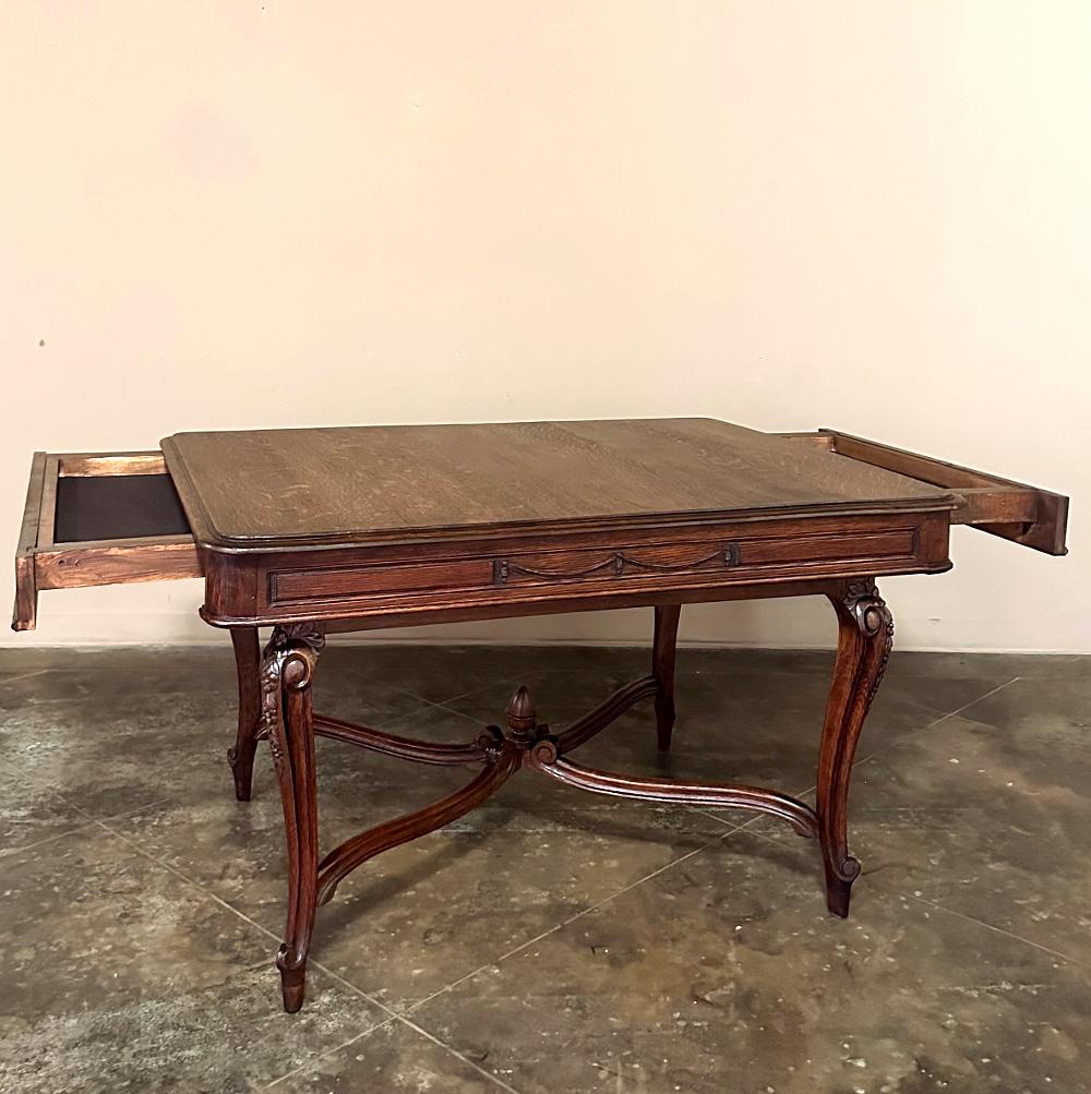 Antique French Louis XVI Desk ~ Library Table ~ Dining Table is able to fill a multitude of roles, and do so in style! Combining elegantly scrolled cabriole legs with subtly scrolled stretchers, it features neoclassical ornamentation rendered in