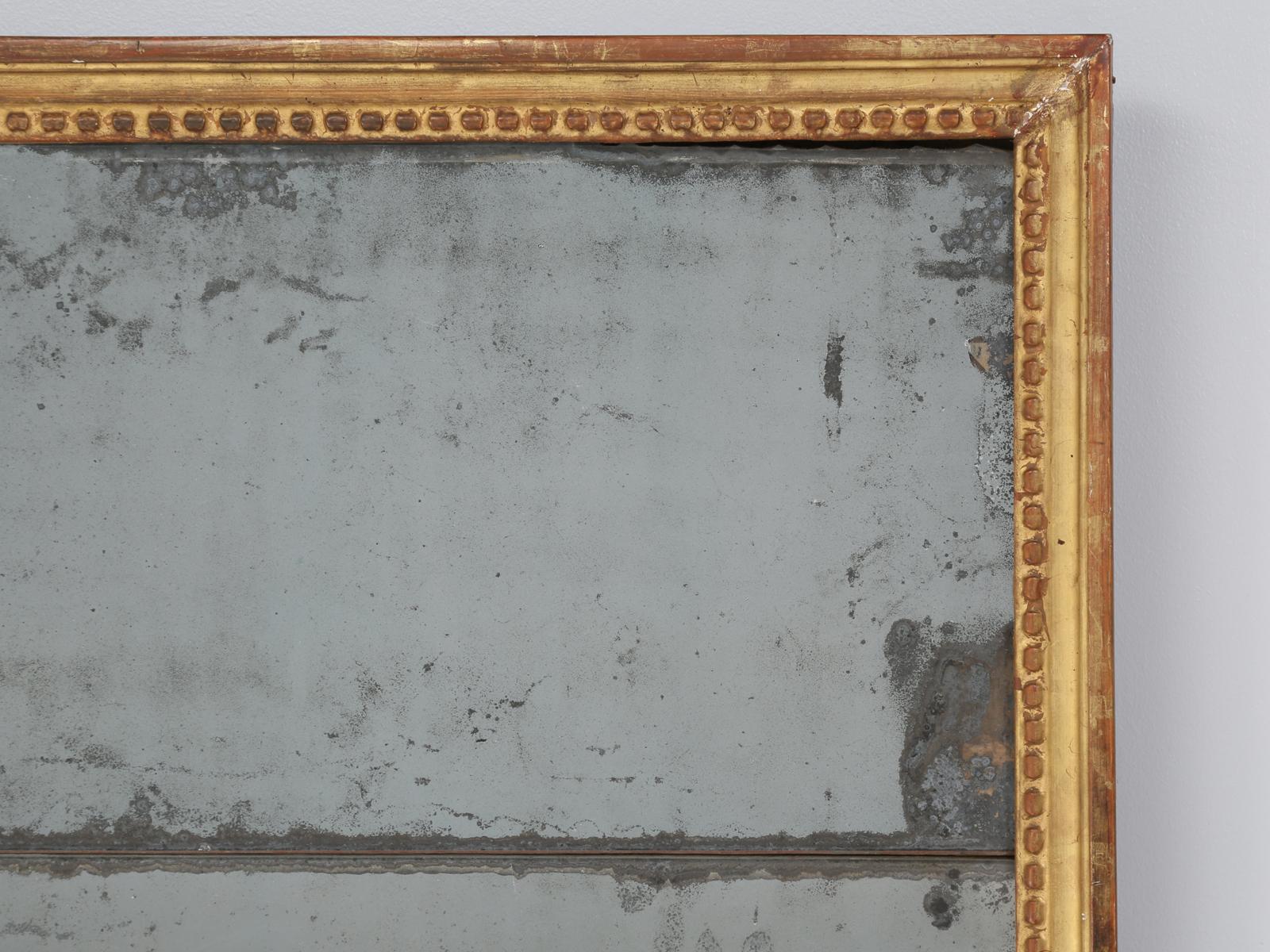 Seems like only once every 4 or 5 years, we get a truly exceptional Louis XVI style mirror and this time, we received a true gem. This antique French Louis XVI mirror, just oozes patina in spades and looks every bit like what you would expect, a