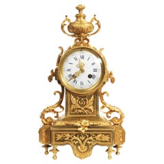 Horloge française ancienne de style Louis XVI en bronze doré