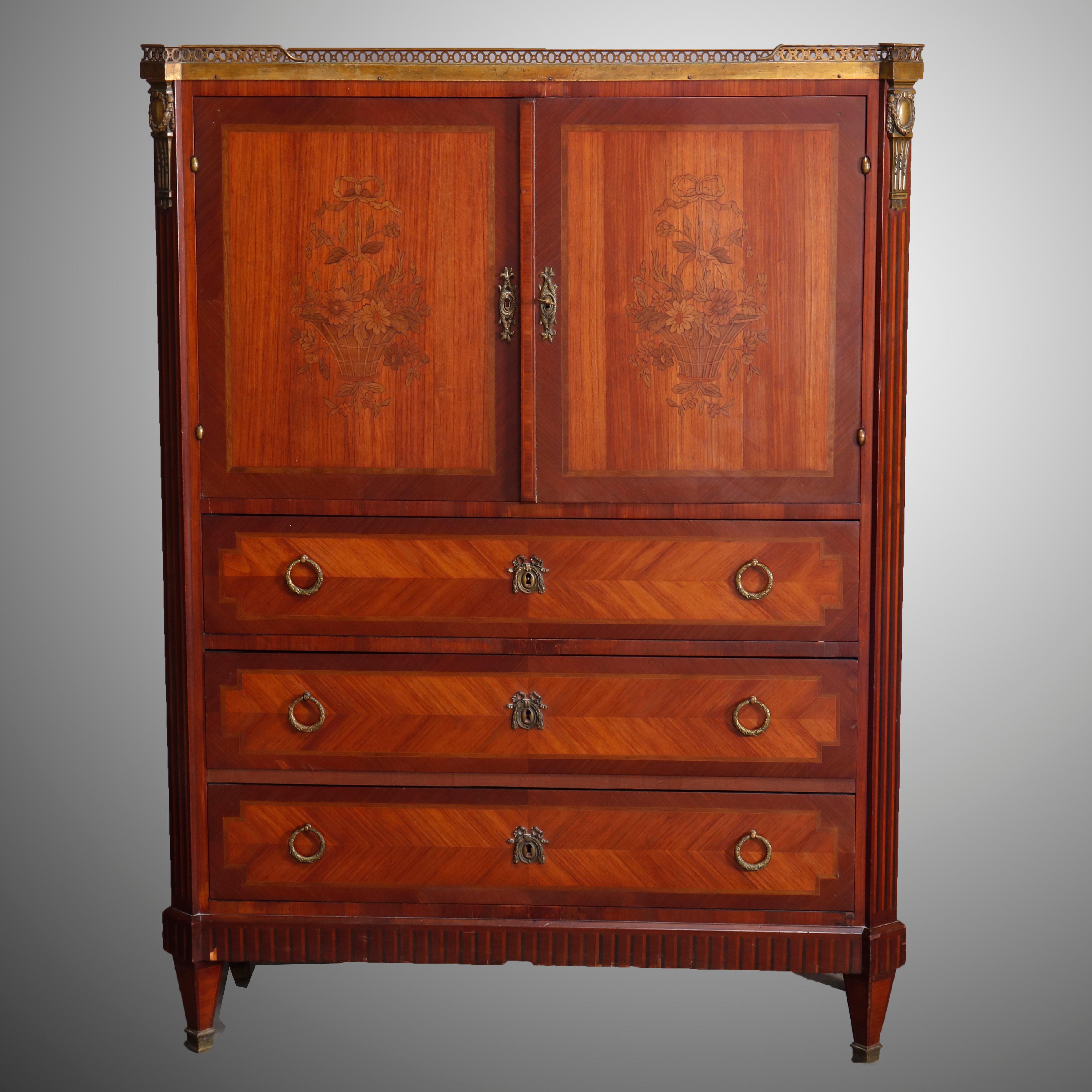 An antique French Louis XVI style tall chest offers mahogany construction with upper having pierced bronze gallery over marble top and with double kingwood inlaid doors each having floral design marquetry and opening to reveal slide out drawers,