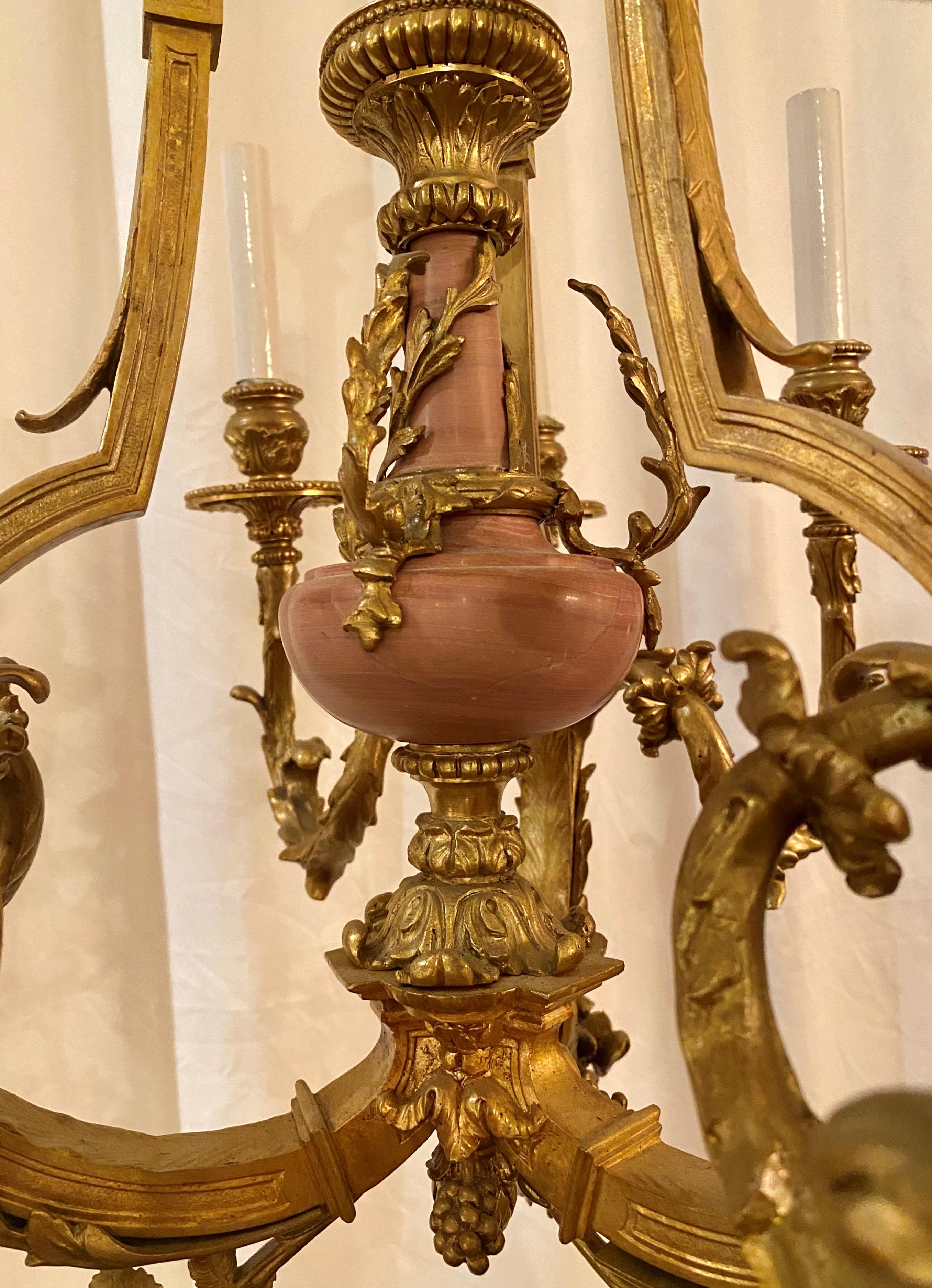 Antique French Louis XVI gold bronze and pink marble chandelier, circa 1865-1880.
CHB118.