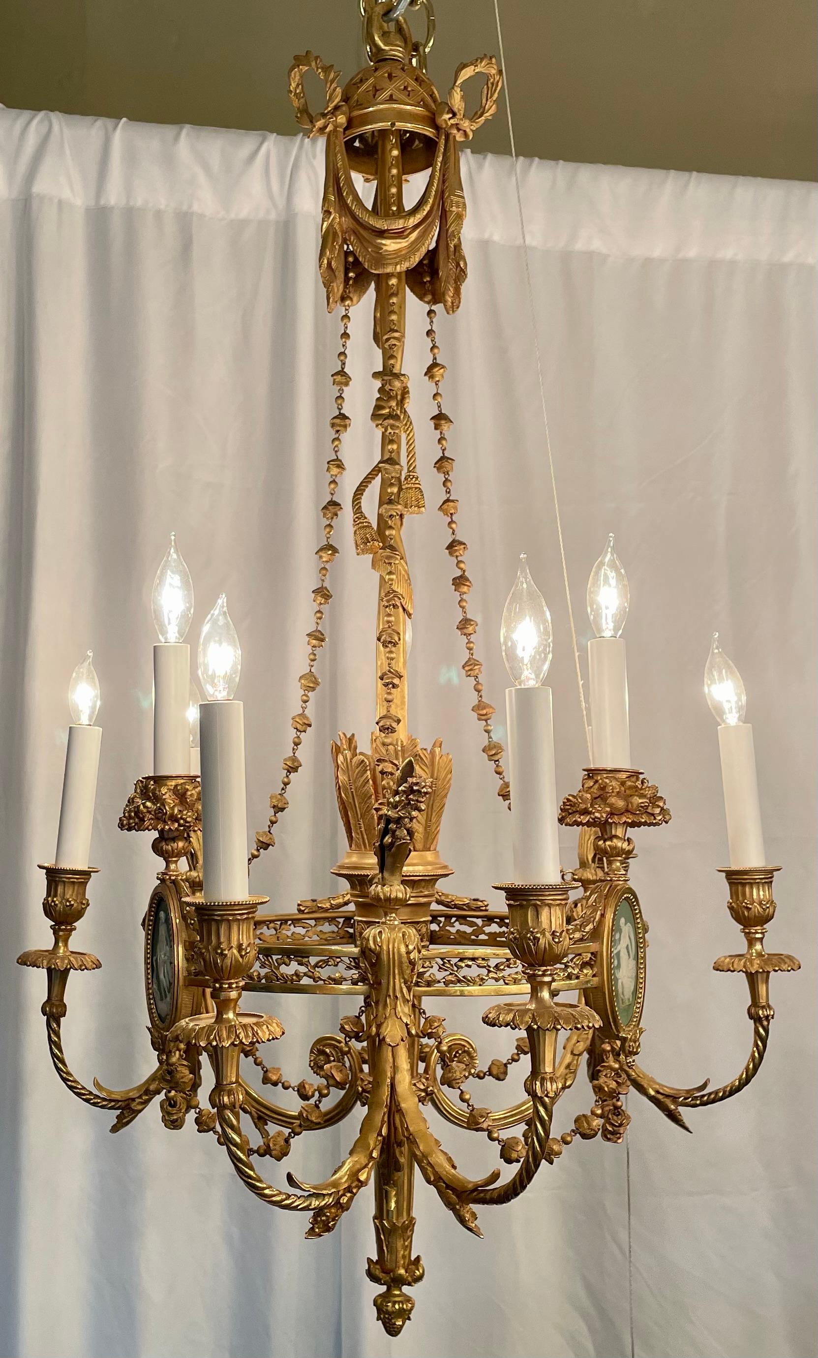 Finest quality antique French Louis XVI style gold bronze chandelier with Wedgwood porcelain mounts, circa 1880.