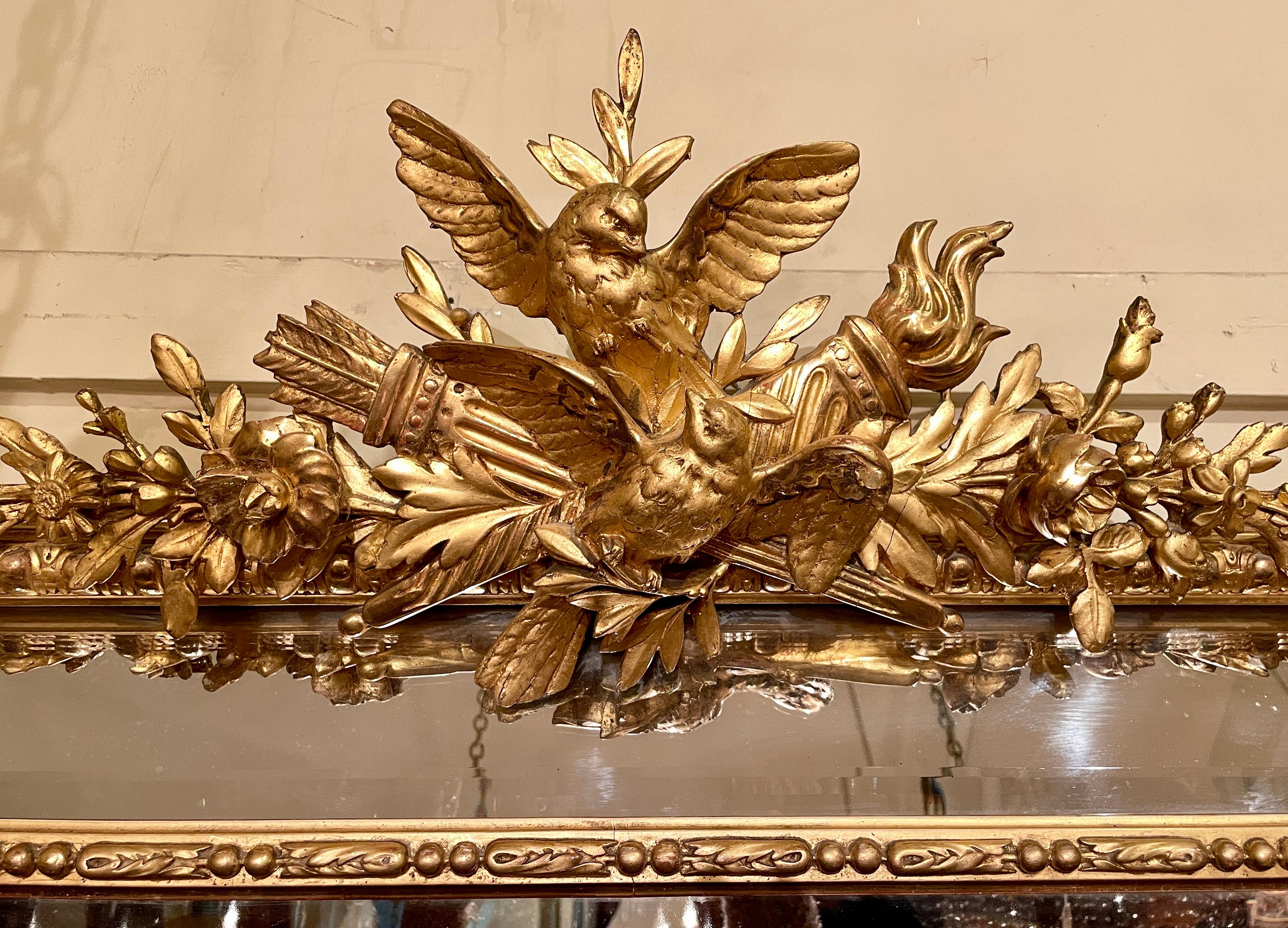 Antique French Louis XVI gold leaf beveled mirror, circa 1890.
