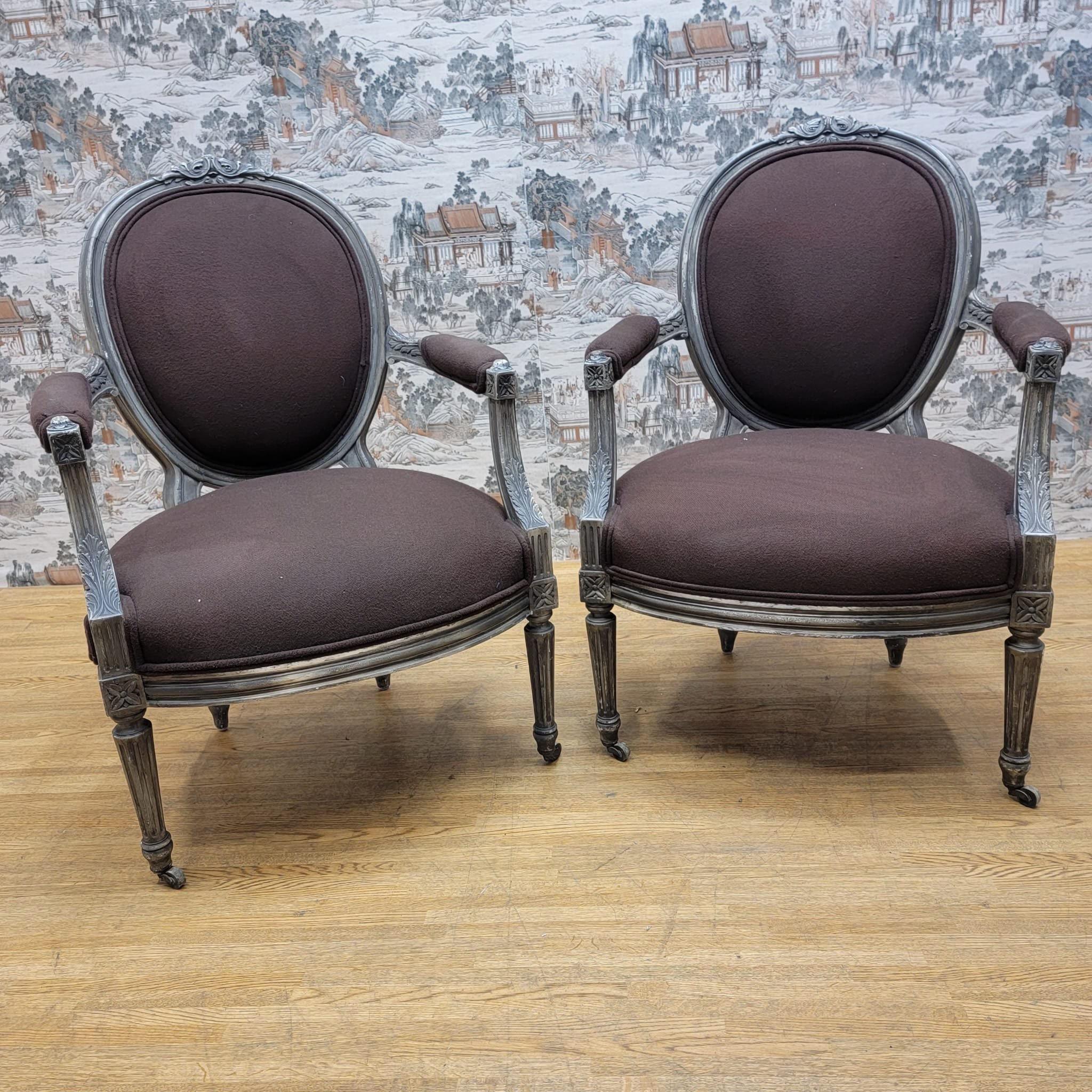 Antique French Louis XVI Style Hand Carved Silver Gilt Framed Fauteuil Armchairs - Pair 

Antique Pair of Louis XVI style Antique Silver Gilt Armchairs/Fauteuils. Each chair features a padded oval back that flows effortlessly into the padded seat.