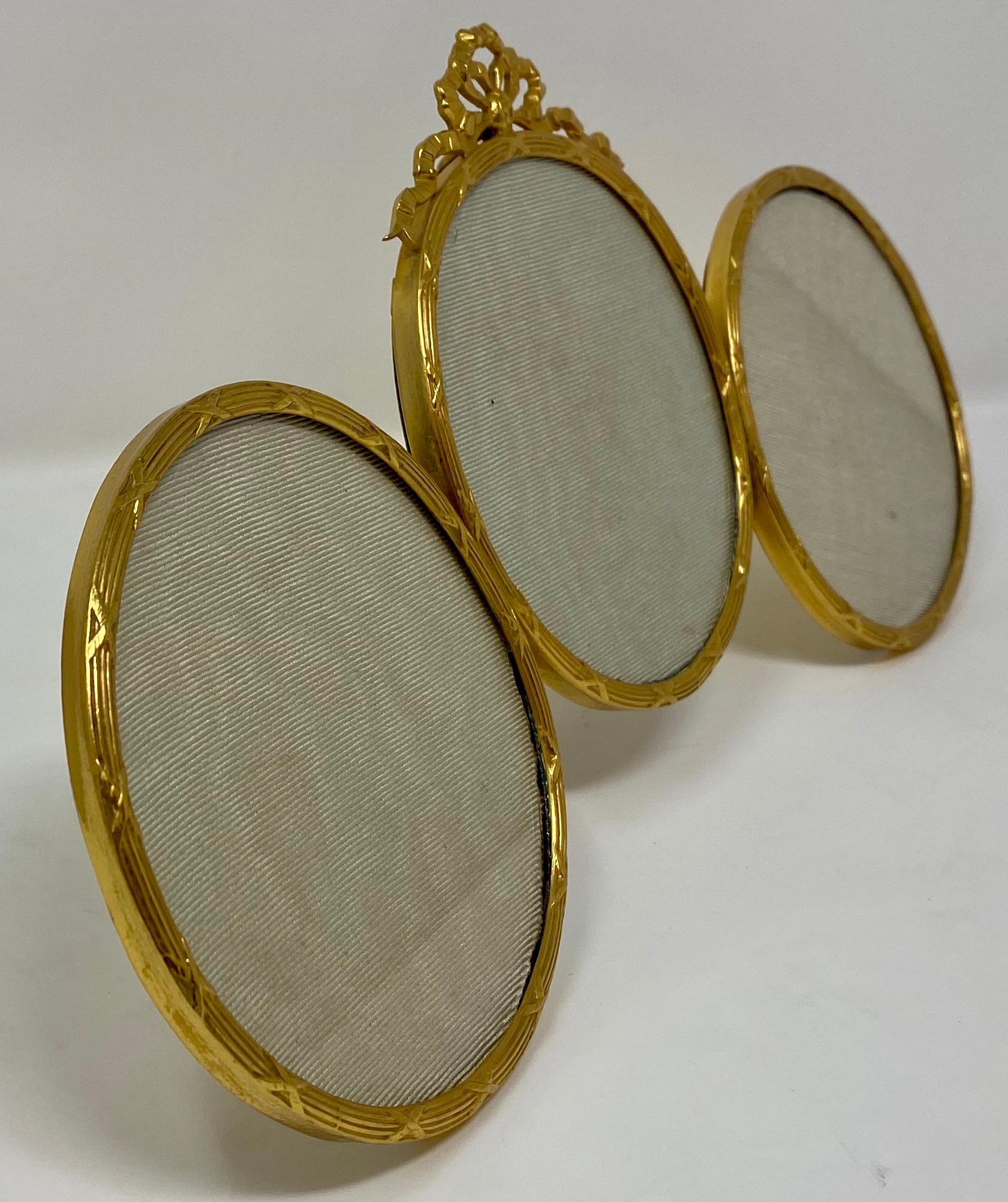Antique French Louis XVI style handmade bronze dore triptych diameter picture frame.
Measures: 5