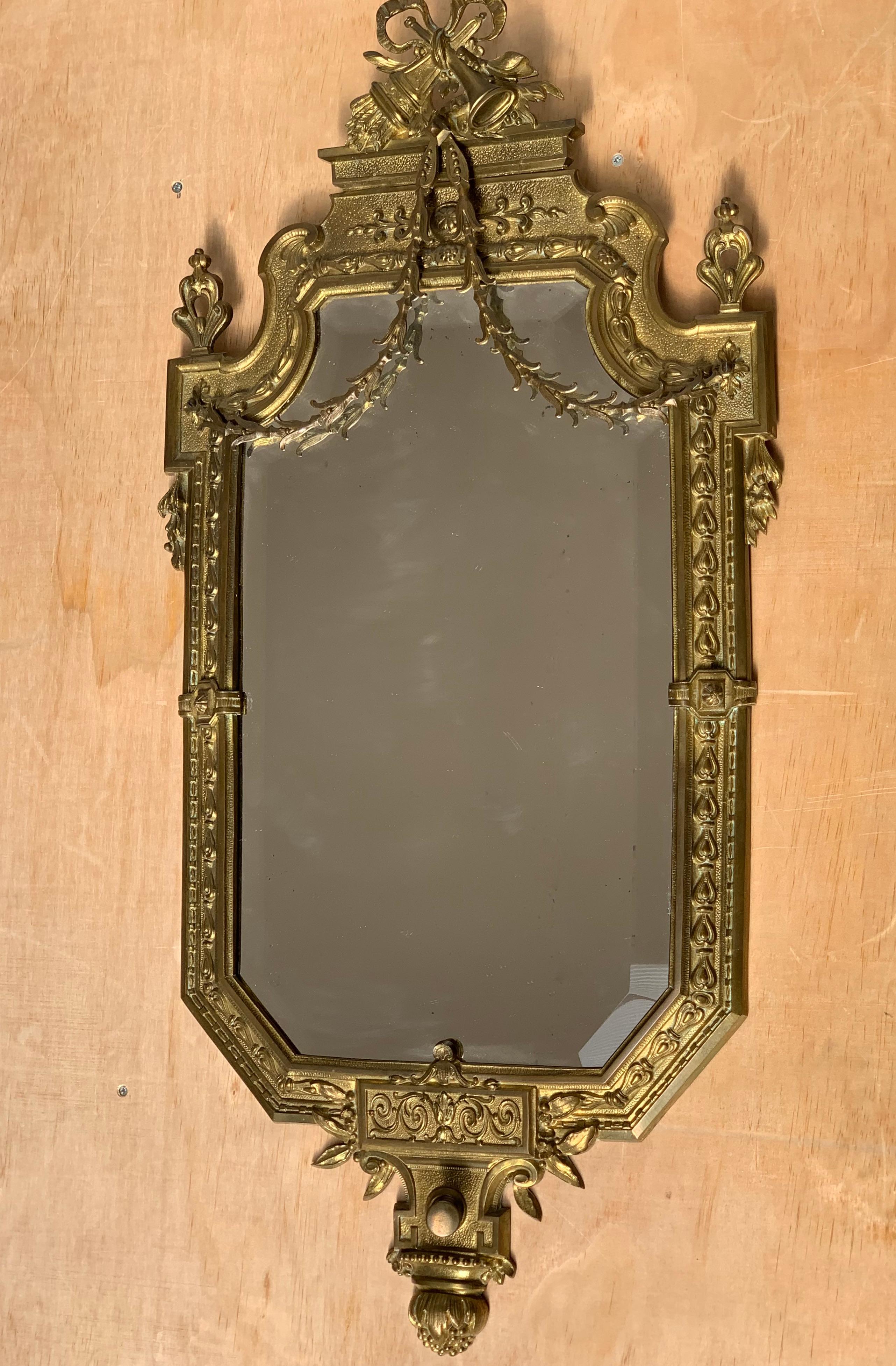 Handcrafted bronze frame and beveled glass wall mirror. 

Have you also wondered why not more people around the globe are buying antiques for the decoration of their homes and offices? The workmanship that it took to create the top quality and