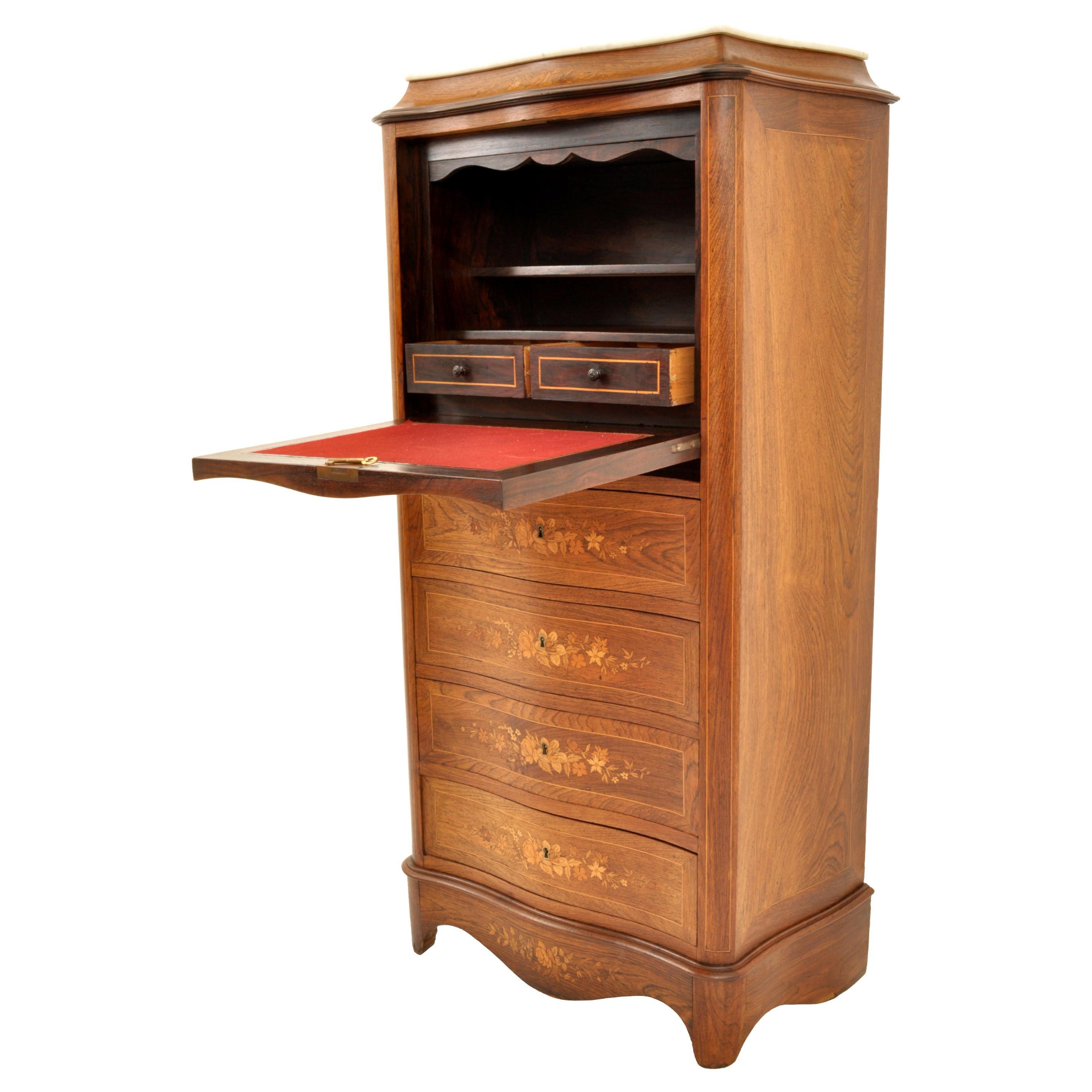 A good quality antique French inlaid marquetry Rosewood secretaire abattant, circa 1880.
Made from the finest rosewood and of serpentine or bombe shape, with a Carrara marble top, the locking fall-front top (with key) delicately inlaid with floral