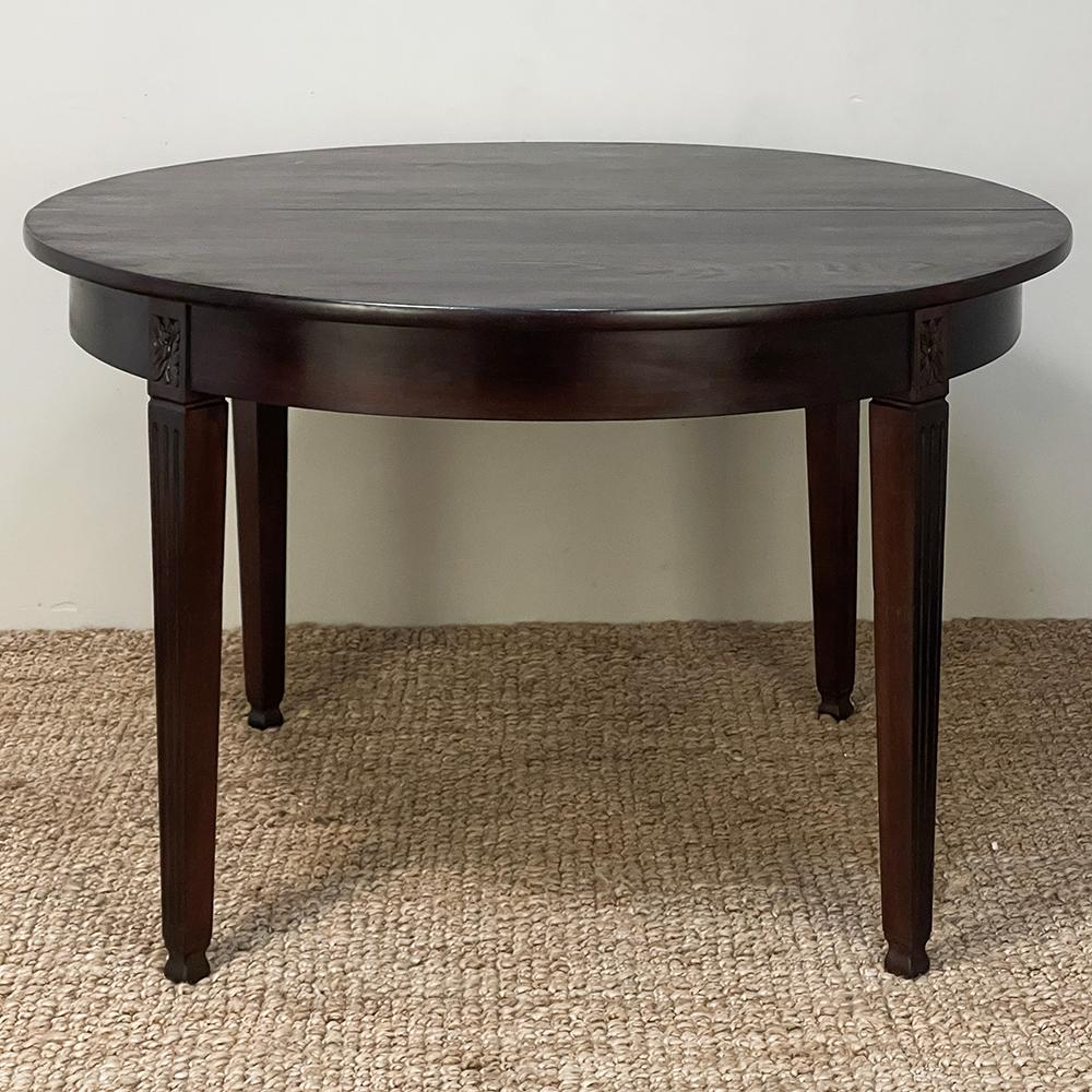 Antique French Louis XVI Mahogany Breakfast ~ Dining Table represents the essence of the tailored look, creating a table just the right size for cozy dining rooms or breakfast nooks.  Crafted from fine imported mahogany, it features a solid plank
