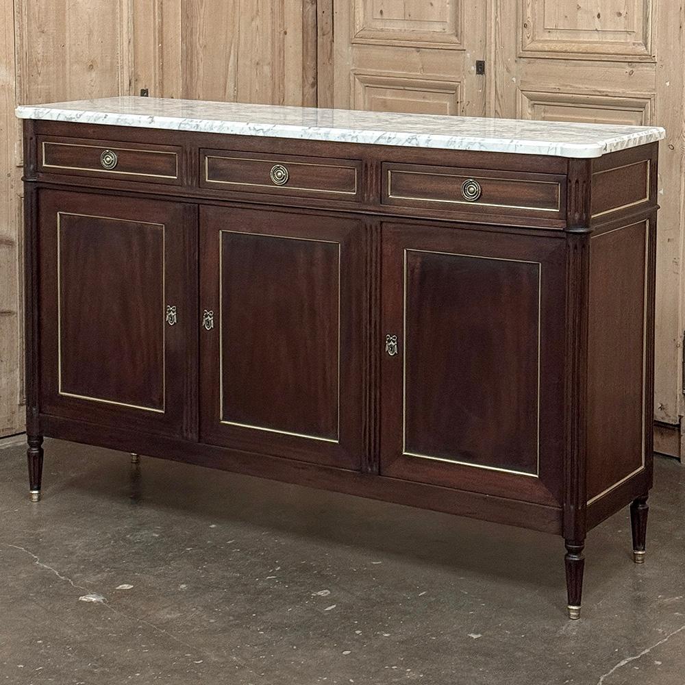 Antique French Louis XVI Mahogany Buffet with Carrara Marble will make a handsome addition to any room!  The tailored, rectilinear architecture has its roots in the glory days of ancient Greece & Rome, with subtle touches that exude a French flair. 