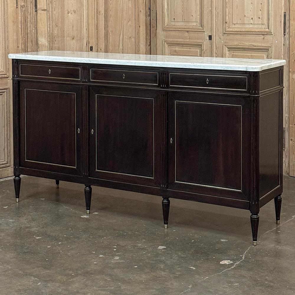 Antique French Louis XVI Mahogany Buffet with Carrara Marble will make a handsome addition to any room!  The tailored, rectilinear architecture has its roots in the glory days of ancient Greece & Rome, with subtle touches that exude a French flair. 