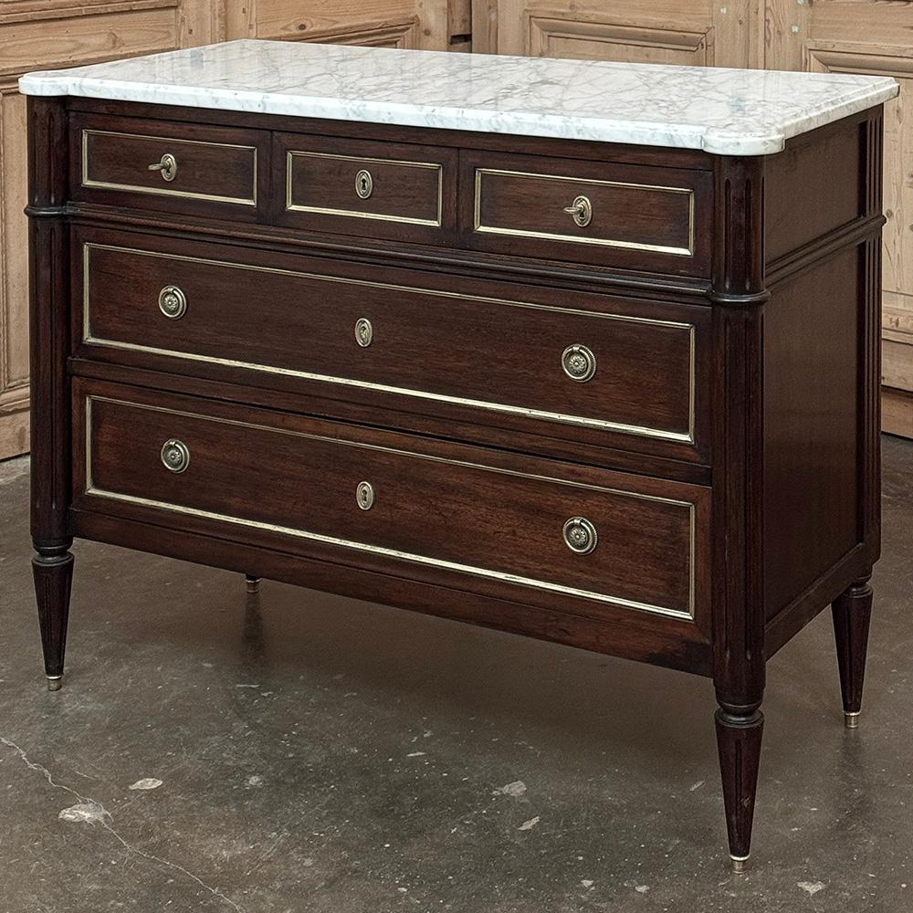 Antique French Louis XVI Mahogany Commode with Carrara Marble will make an elegant addition to any decor!  Crafted from exotic imported mahogany, it features a tailored neoclassical architecture, with straight lines mixed with rounded corners