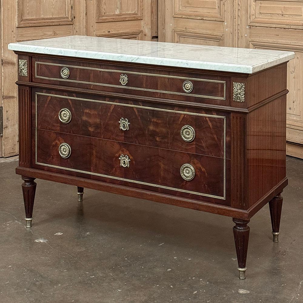 Antique French Louis XVI Mahogany Commode with Carrara Marble will make an elegant addition to any decor!  Crafted from exotic imported mahogany, it features a tailored neoclassical architecture, with straight lines mixed with rounded corners
