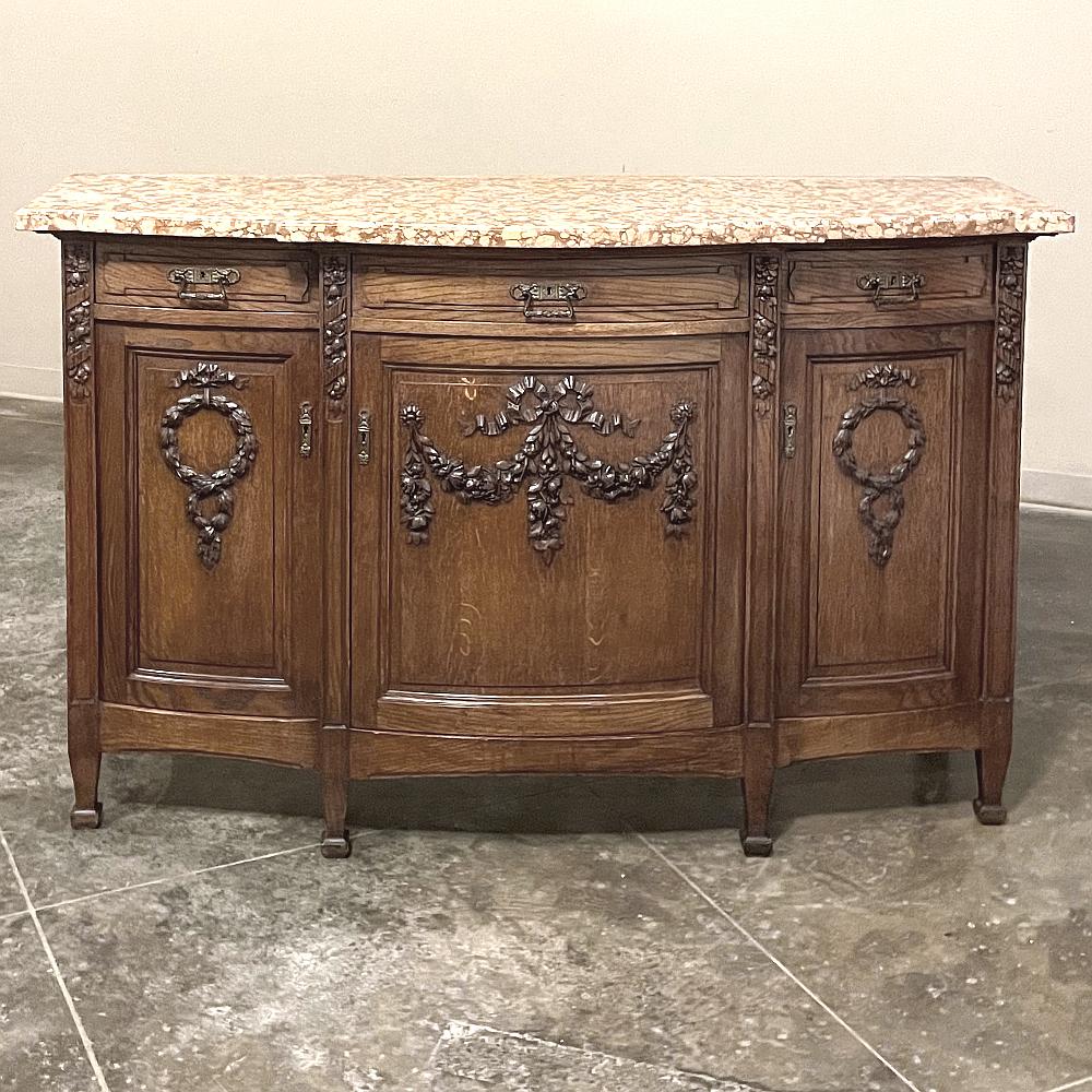 Antique French Louis XVI Marble top buffet will make a wonderful addition to a classic decor! Rendered from dense, old-growth white oak, it features a subtle combination of the step front married to a bowed center section creates visual appeal from