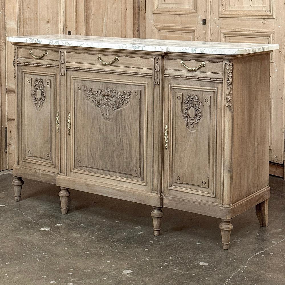 Antique French Louis XVI Marble Top Buffet in Stripped Walnut is a splendid combination of timeless elegance and casual flair!  Hand-crafted from sumptuous walnut, the amazing grain of the wood has been realized by our proprietary in-house stripping