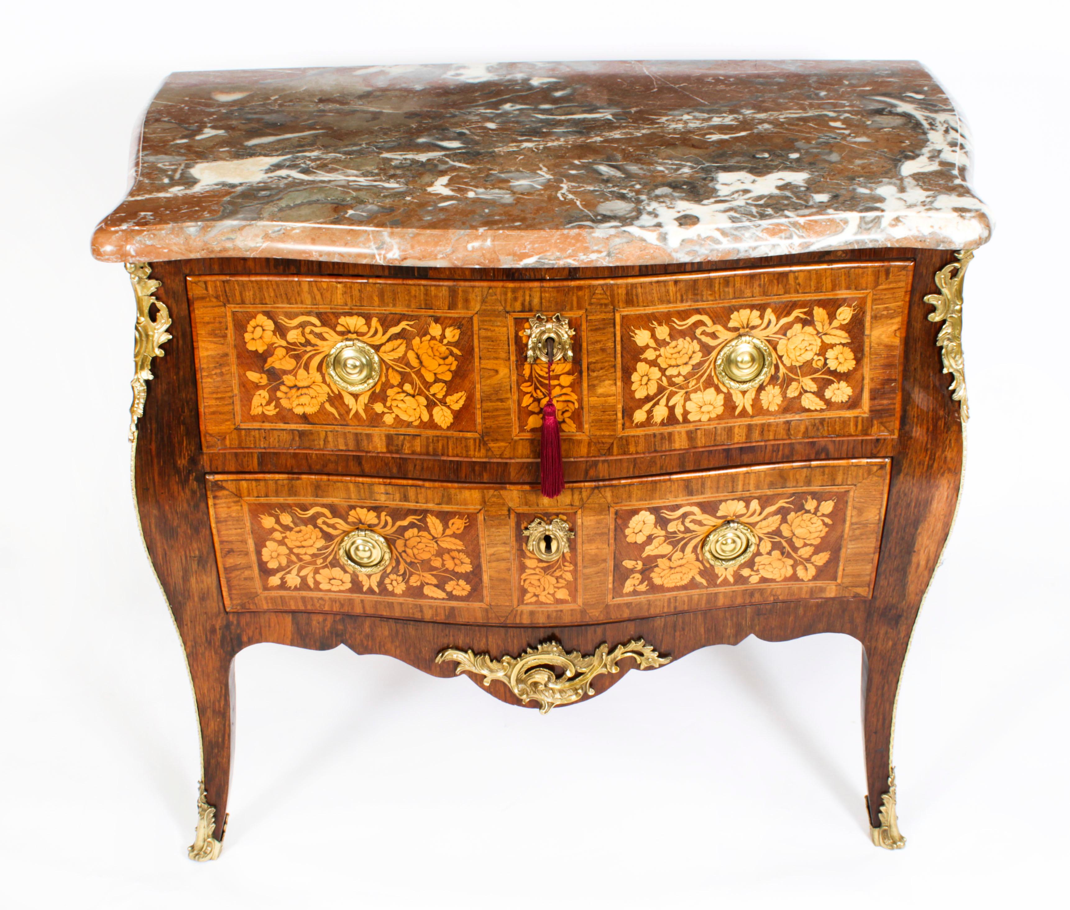 This is a beautiful antique French Louis XVI walnut and marquetry ormolu mounted commode, circa 1780 in date.
 
It has a stunning shaped Rouge de Rance marble top above two full width drawers finely inlaid with scrolling foliate and floral
