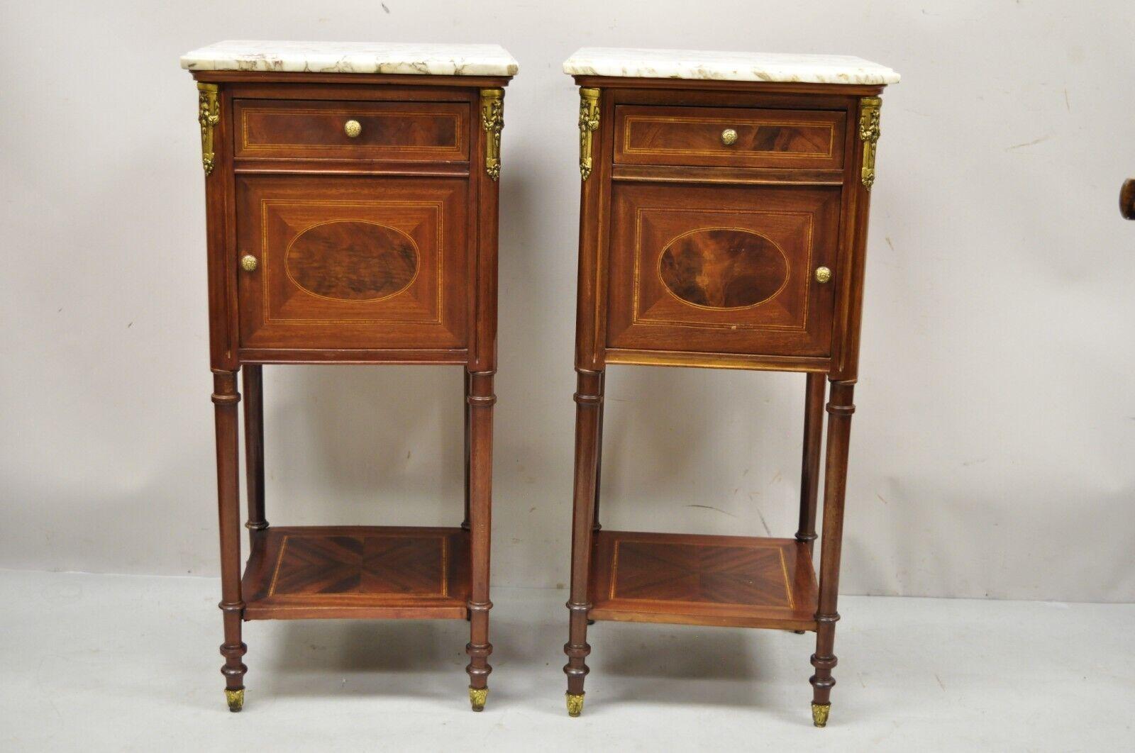 Antique French Louis XVI style marquetry inlay marble top nightstand washstands - a pair. Item features porcelain interior, marquetry inlay, bronze ormolu, lower shelf, removable marble top, finished back,1 dovetailed drawer, very nice antique pair,