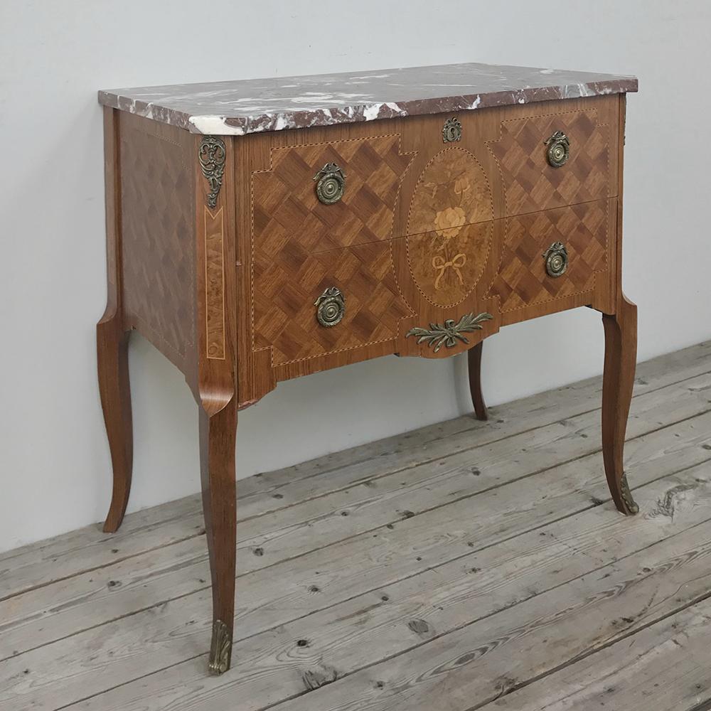 Antique French Louis XVI marquetry marble top commode combines the talents of an expert cabinet maker able to create the stately architecture of the case, with the ebeniste who applies inlay and marquetry on the exterior to provide adornment. Next,
