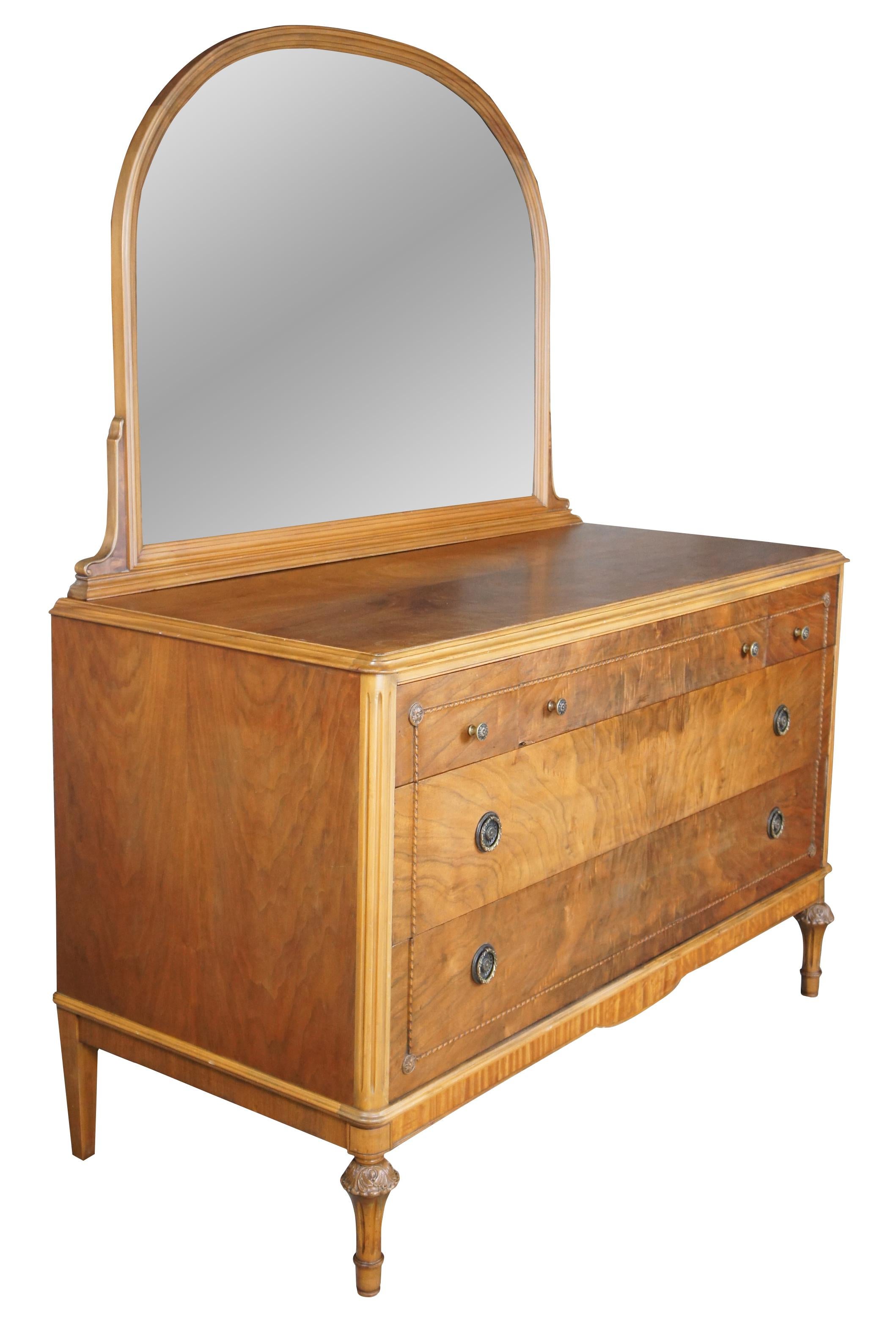 Antique Art Deco vanity dresser featuring a domed / arched mirror, five drawers and carved legs.

Measures: 24