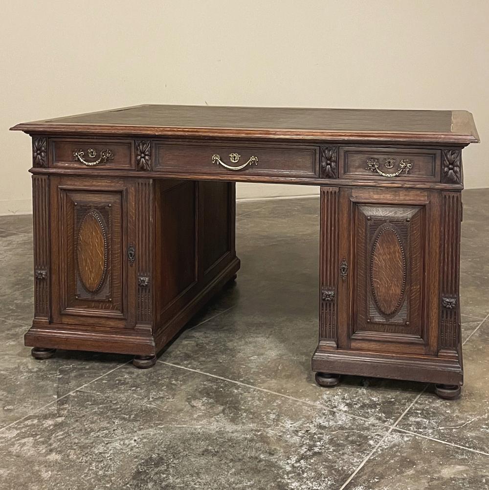 Antique French Louis XVI Neoclassical Double Faced desk has captured the essence of the architecture and embellishment of ancient Greece and Rome! Hand-crafted from solid oak, it has been fully finished on all sides, even the interior space between