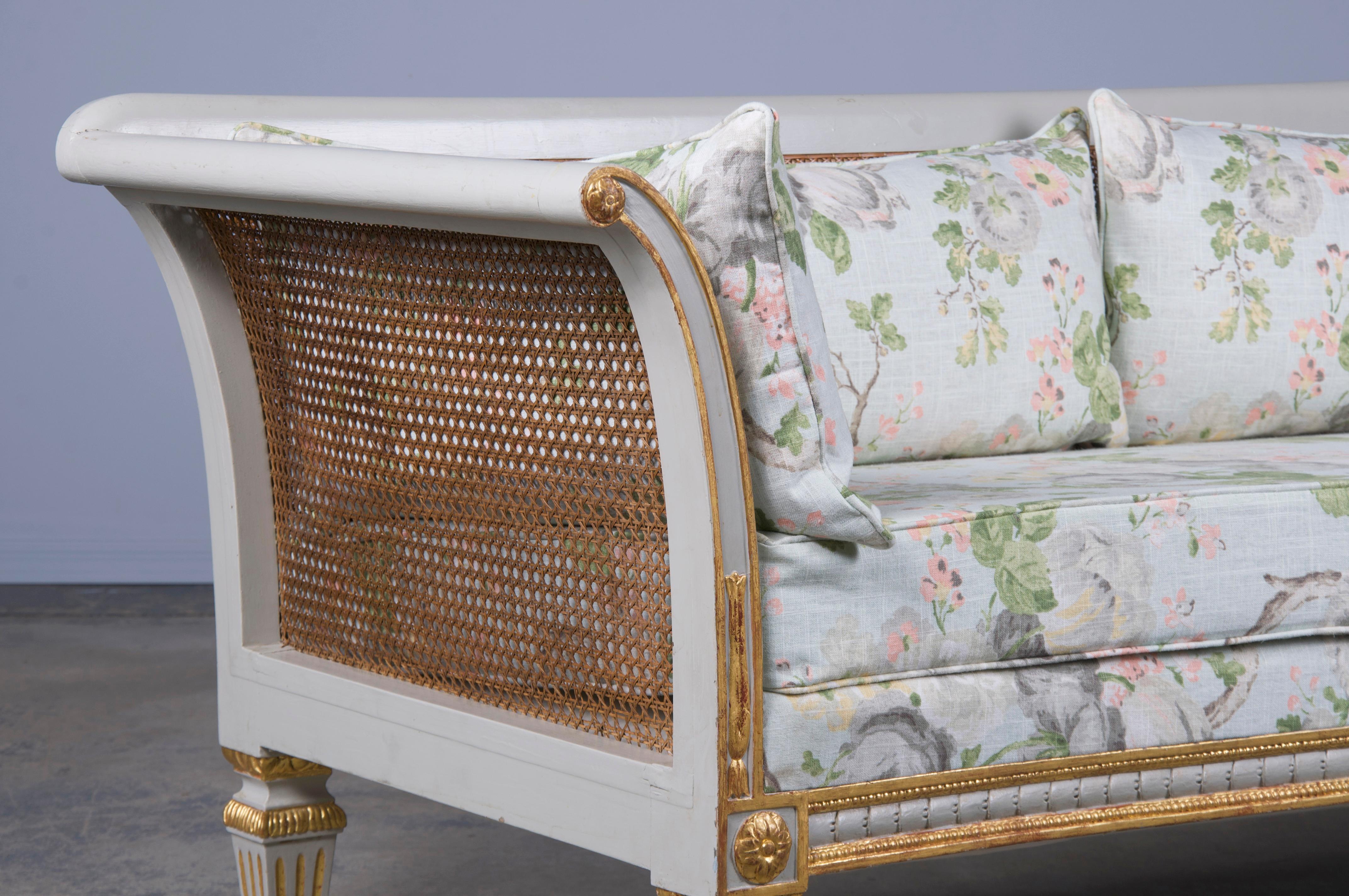 XIX secolo Antique French Neoclassical Style Painted Cane Back Loveseat W/ Floral Linen in vendita