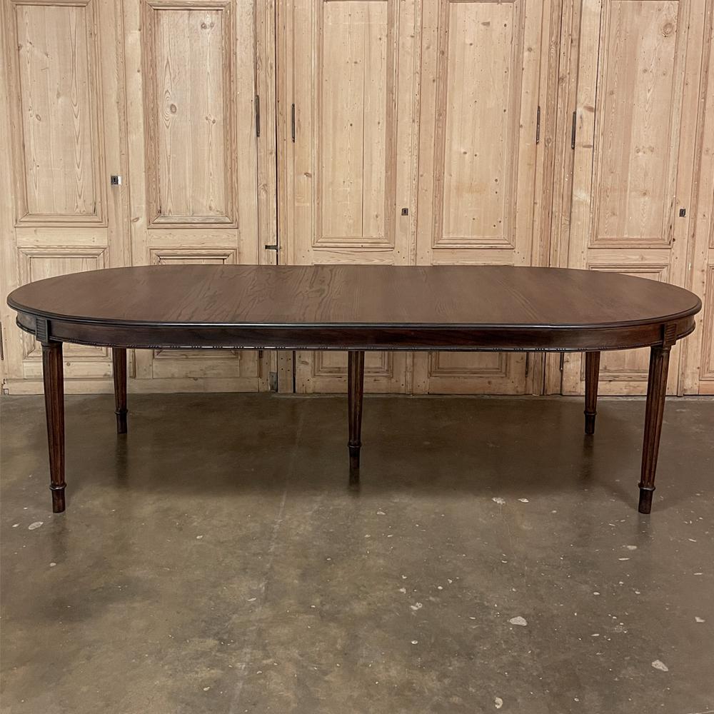 Antique French Louis XVI oval banquet table is the perfect size for entertaining, seating eight comfortably, and ten for special occasions! Hand-crafted from solid oak, it features a rich, luxurious finish and five legs with the center leg providing