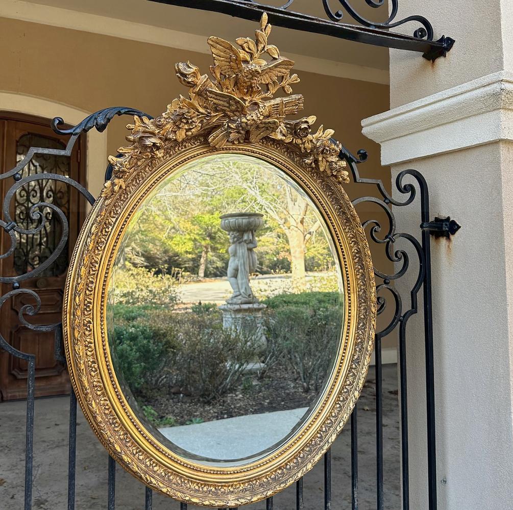 20th Century Antique French Louis XVI Oval Gilded Mirror For Sale