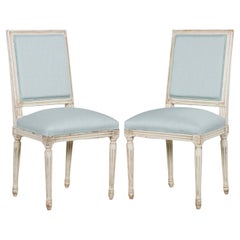 Antiguos sillones franceses Luis XVI pintados de azul claro - Pareja