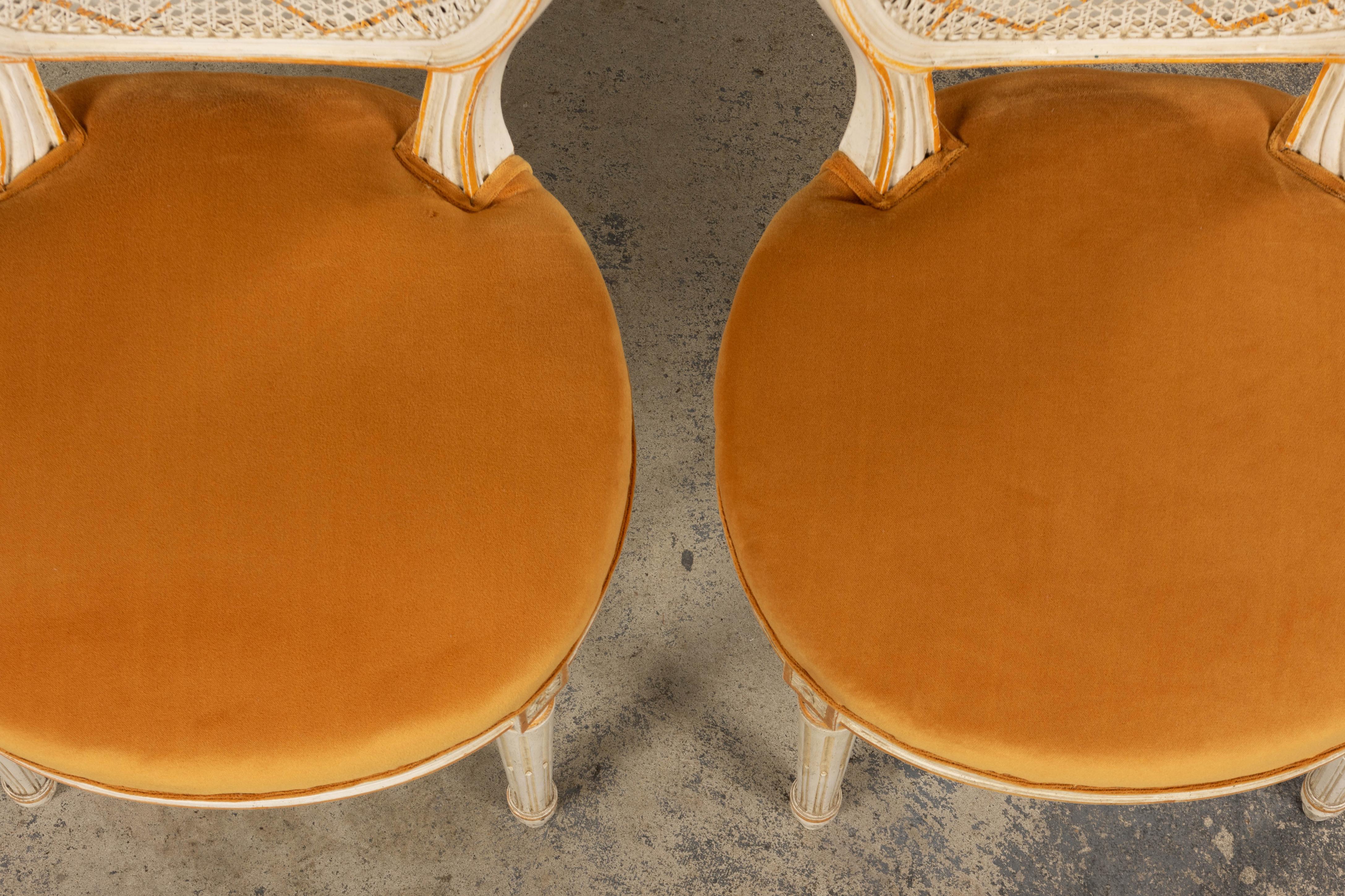 Hand-Carved Antique French Louis XVI Painted Cane Back Accent Side Chairs W/ Marigold Velvet For Sale