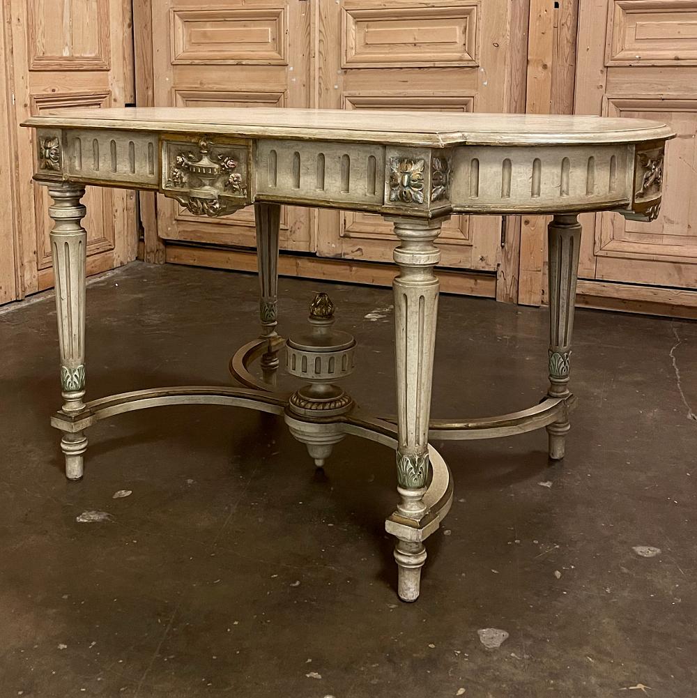 Antique French Louis XVI painted center table is a magnificent example of the genre! Classic architecture inspired by ancient Greece and Rome pervades the entire design, which features rounded ends that present a very traffic-friendly footprint for