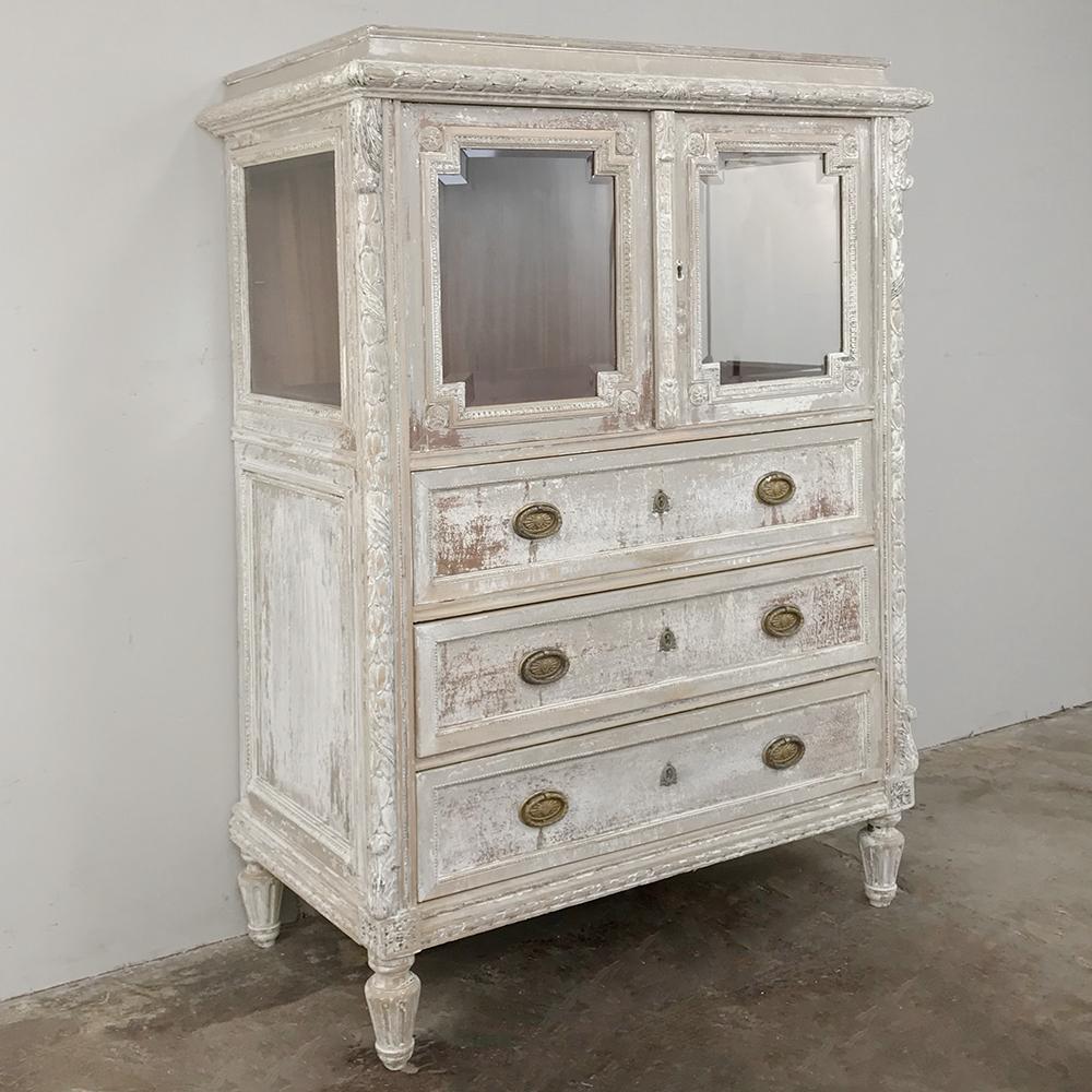 Antique French Louis XVI painted linen chest is an ideal choice for a special niche, bathroom or bedroom! Display space is afforded by the glazed upper cabinets surrounded by Fine carved detailing and molding, all of which overlooks the three