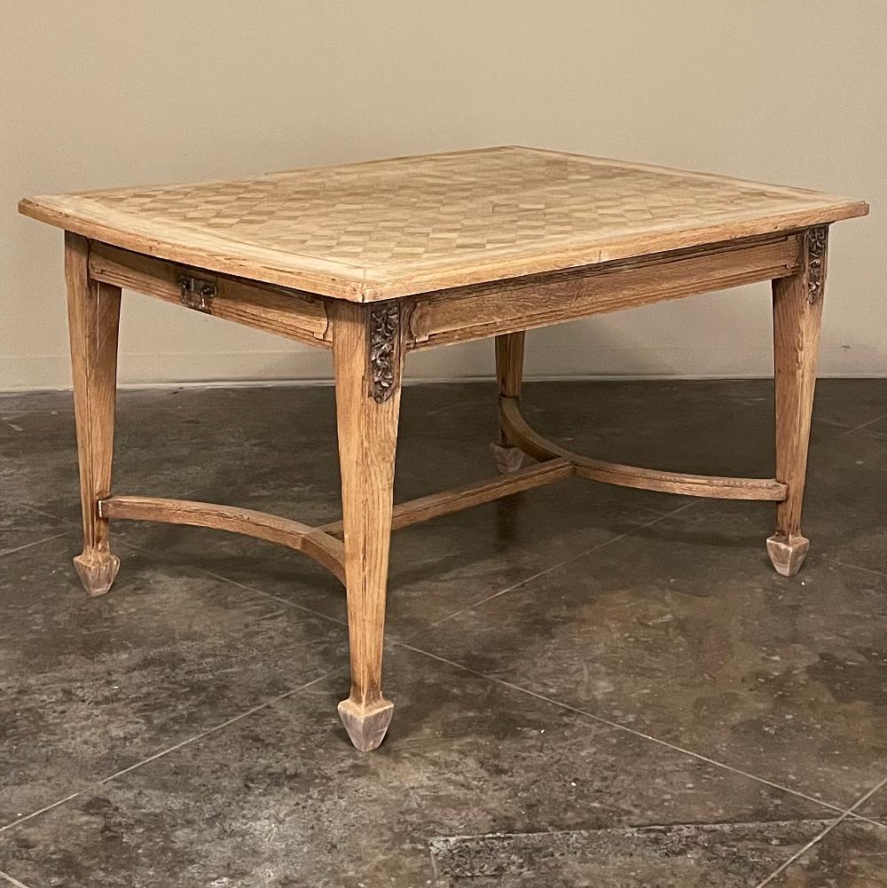 Antique French Louis XVI parquet table in stripped oak combines form and function in a truly classic style! Inspired by the architecture of ancient Greece and Rome, it features a rectilinear framework enhanced by subtly curved table ends, tapered