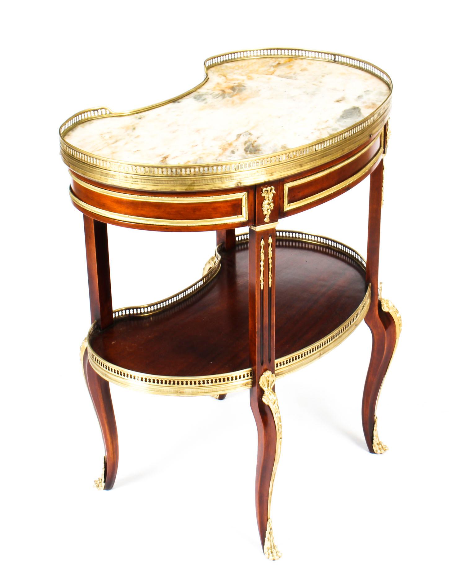 This is a very fine antique French Louis XVI revival mahogany, marble and ormolu kidney-shaped side table, circa 1860 in date.
 
This delightful side table has been masterfully crafted from beautiful mahogany and features a decorative ormolu