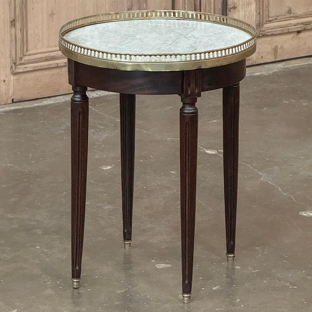 Antique French Louis XVI Round Mahogany End Table with Carrara Marble will make the perfect accompaniment to any seating group!  Crafted from imported mahogany ~ considered one of the finest furniture woods in the world ~ its round shape makes it