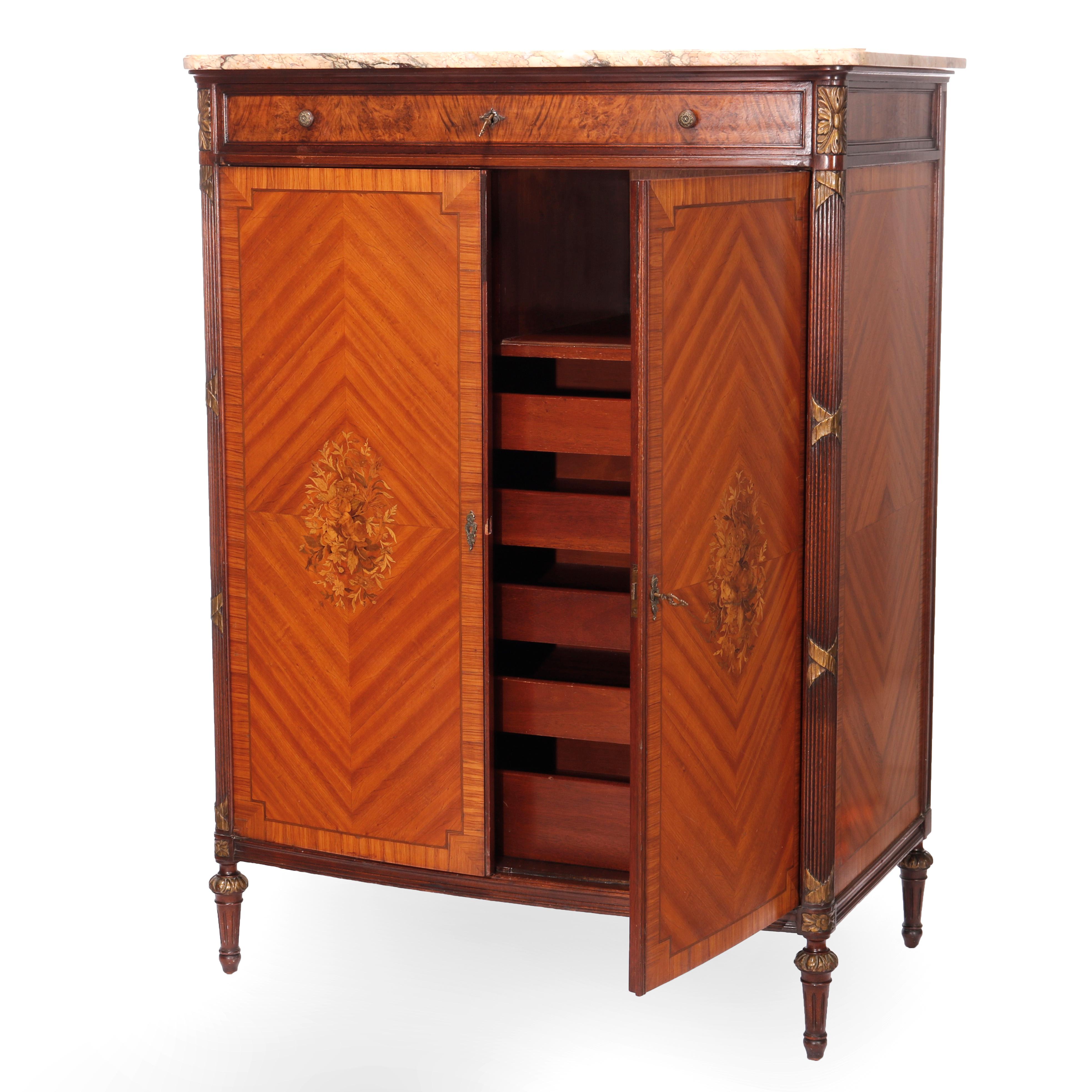 An antique French Louis XVI gentleman's chest offers beveled marble top over mahogany base with bookmatched satinwood facing with single frieze drawer surmounting double doors having floral inlay marquetry opening to interior with slide out drawers,