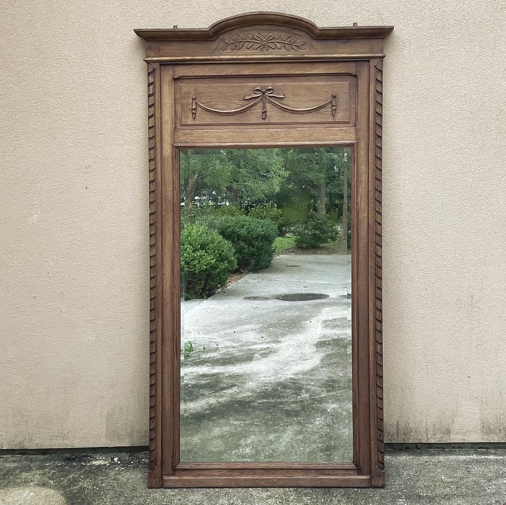 Antique French Louis XVI stripped oak mirror ~ Trumeau is the perfect choice for creating timeless elegance yet with a casual flair ideal for today's relaxed interiors! The original silvering on the original beveled mirror takes up about