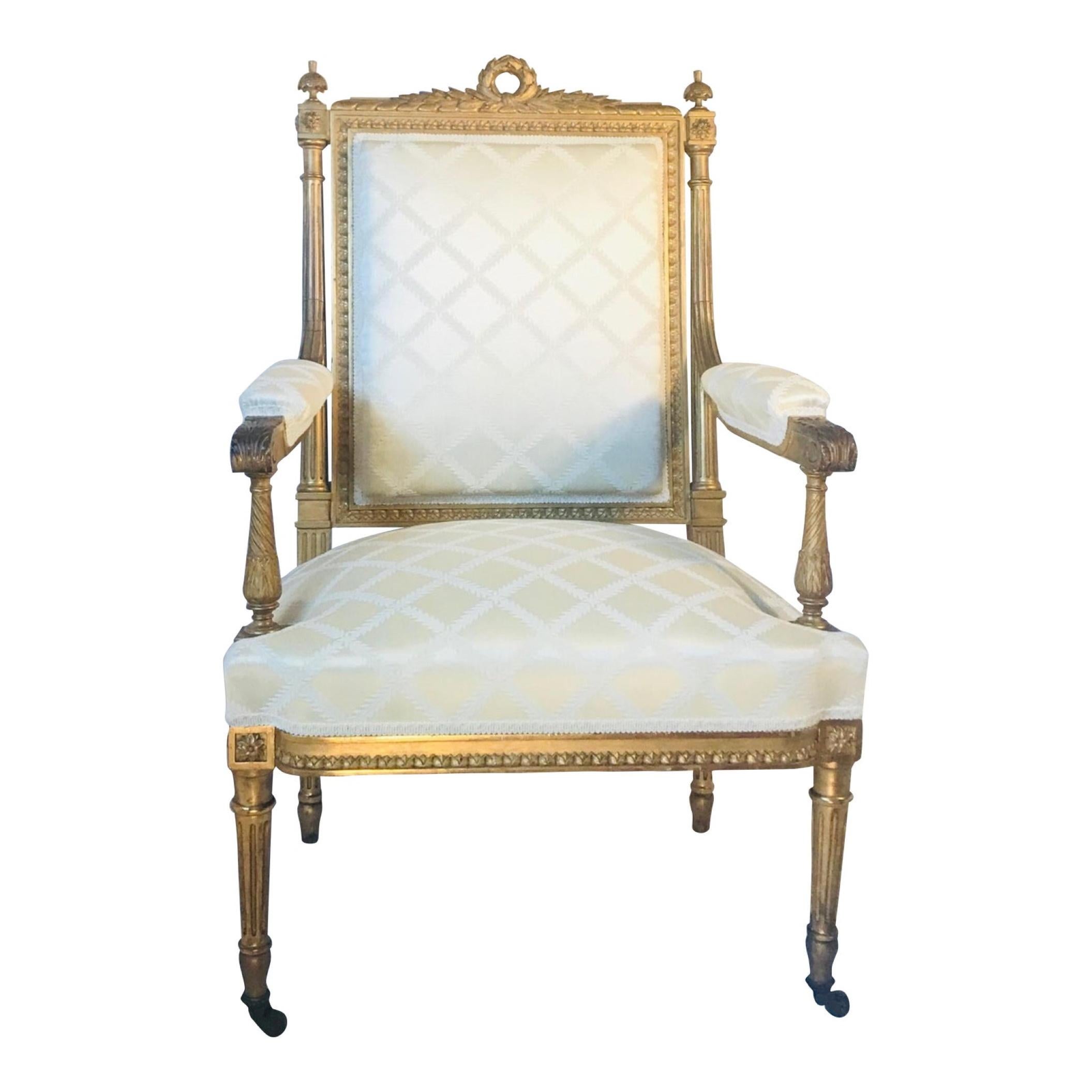Antique French Louis XVI style armchair a la Reine after Georges Jacob, 19th century.

This beautiful Fauteuil is carved from walnut and gold leaf gilded. It is upholstered in champagne silk damask. The tapered fluted straight legs are resting on