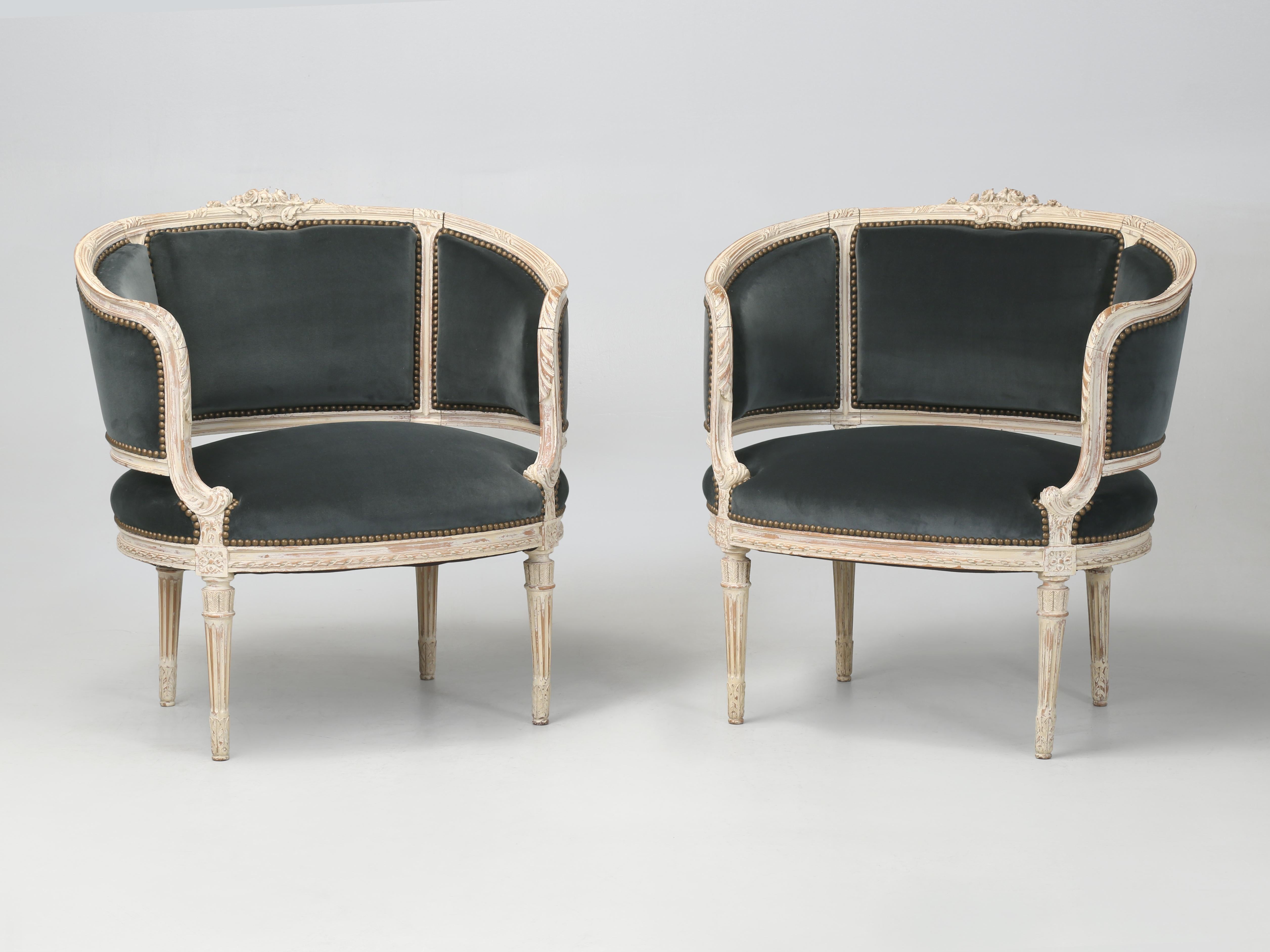 Antique French Louis XVI Style Armchairs or Bergère Chairs from the 1800’s. Our inhouse Old Plank upholstery department completely stripped the Louis XVI Barrel Back Bergère Chairs to the bare wood frame and carefully rebuilt each of the Louis XVI