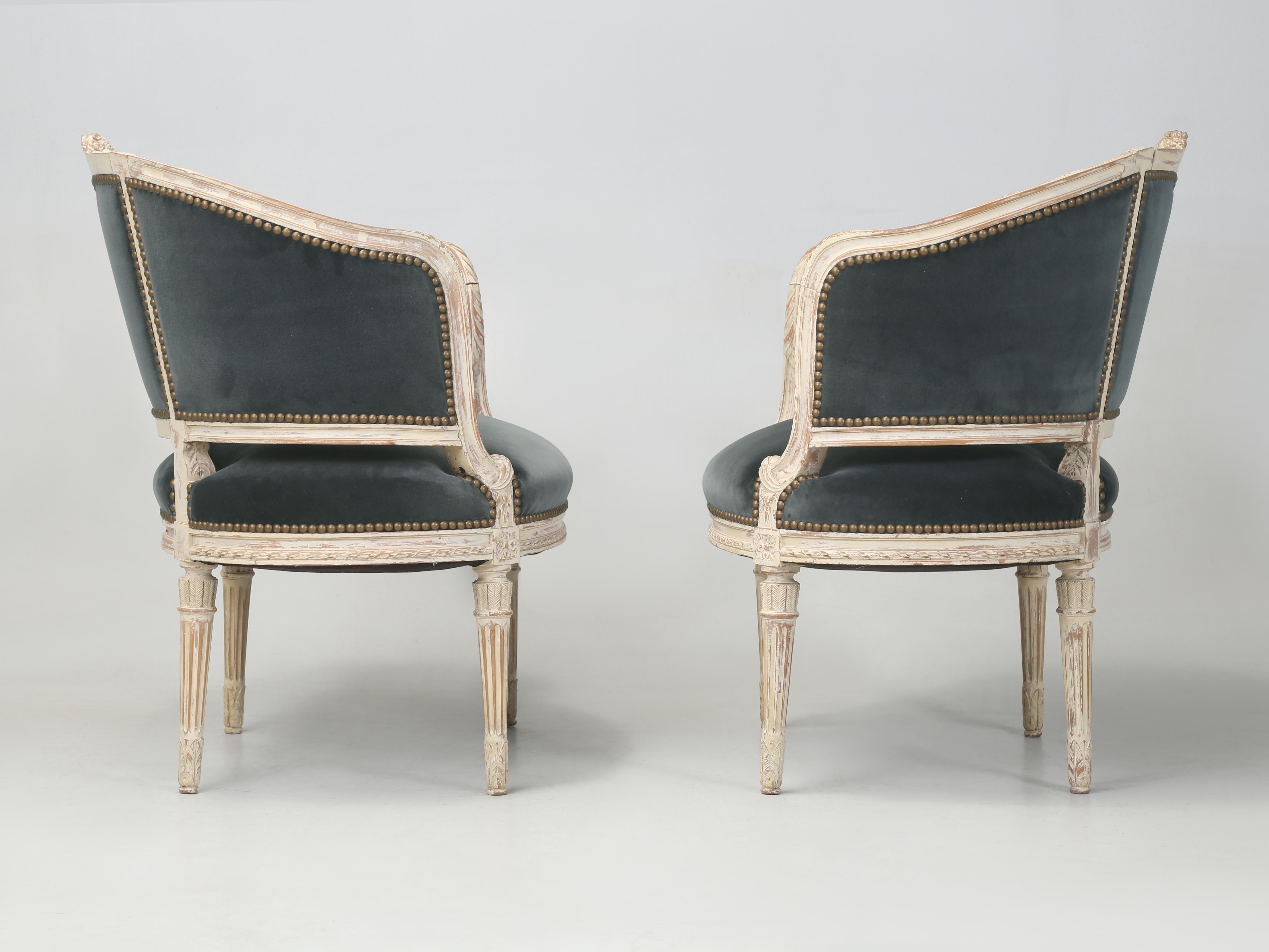 Carved Antique French Louis XVI Style Armchairs or Bergère Chairs from the Early 1800’s For Sale